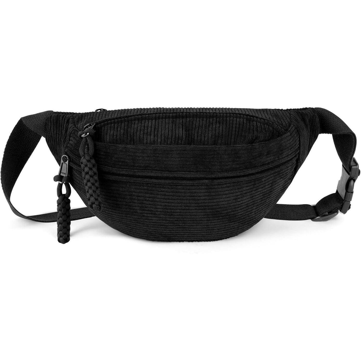 Schwarze gerippte Bauchtasche mit verstellbarem Riemen und gewebtem Reißverschluss-Anhänger, gezeigt vor weißem Hintergrund.