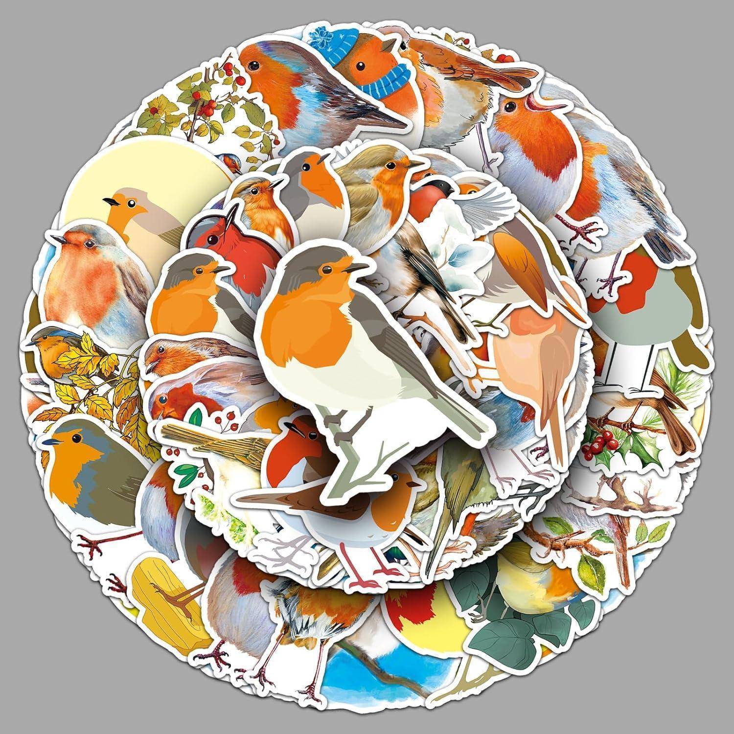 Ein Haufen bunter Vogelaufkleber, überwiegend Rotkehlchen und andere kleine Vögel, die sich überlappend in einer kreisförmigen Collage auf grauem Hintergrund anordnen.