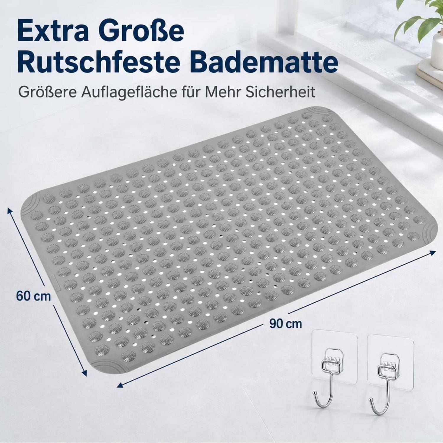 Graue, extra große rutschfeste Badematte mit Saugnäpfen, beschriftet 90 cm x 60 cm, in einem Badezimmer gezeigt für zusätzliche Sicherheit.