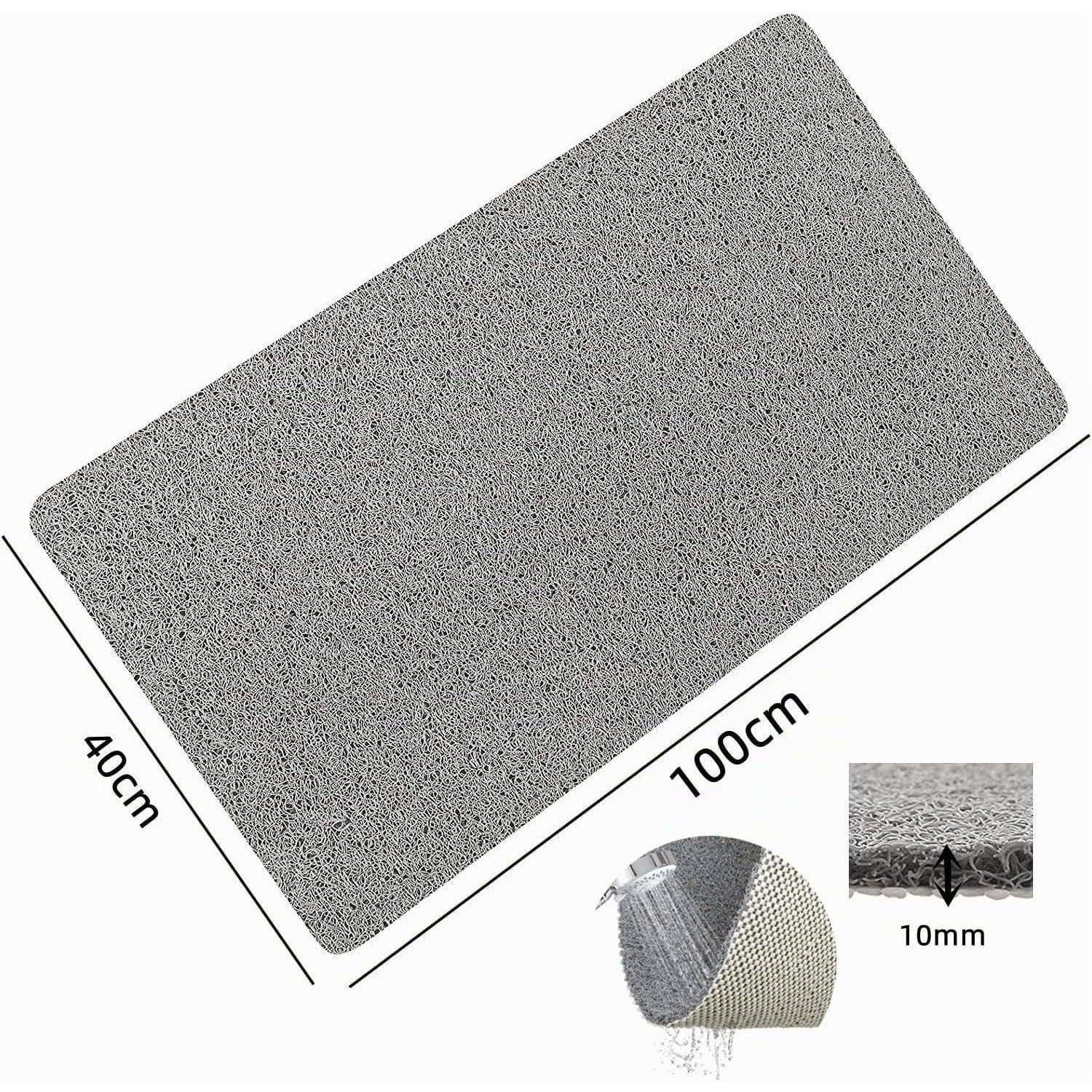Graue rechteckige rutschfeste Matte, mit den Abmessungen 100 cm x 40 cm und 10 mm Dicke gekennzeichnet, mit eingefügten Nahaufnahmen, die die strukturierte Oberfläche und die mehrschichtige Unterseite zeigen.