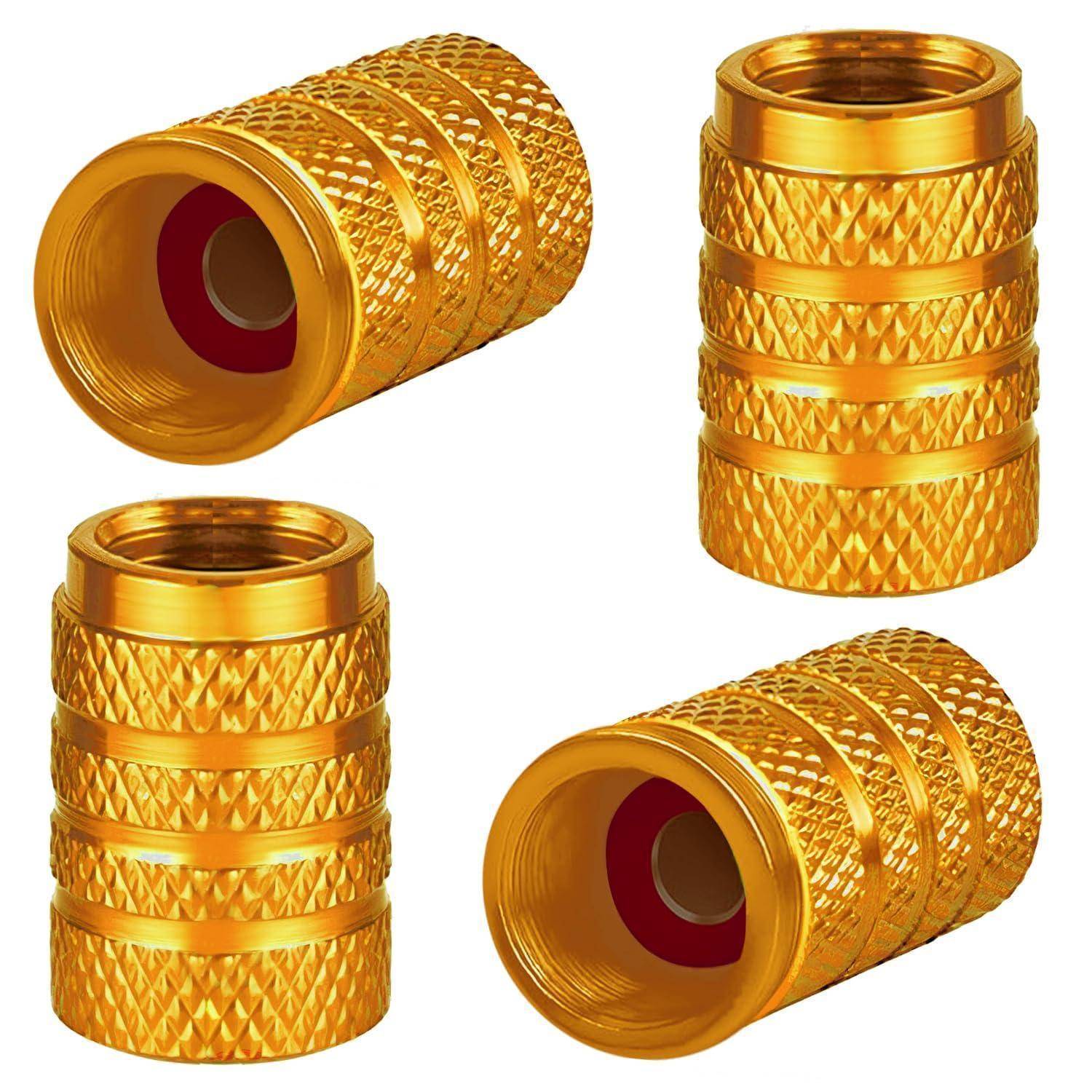Vier goldfarbene gerillte Metallverbinderkappen oder Fittings von verschiedenen Winkeln auf weißem Hintergrund gezeigt.