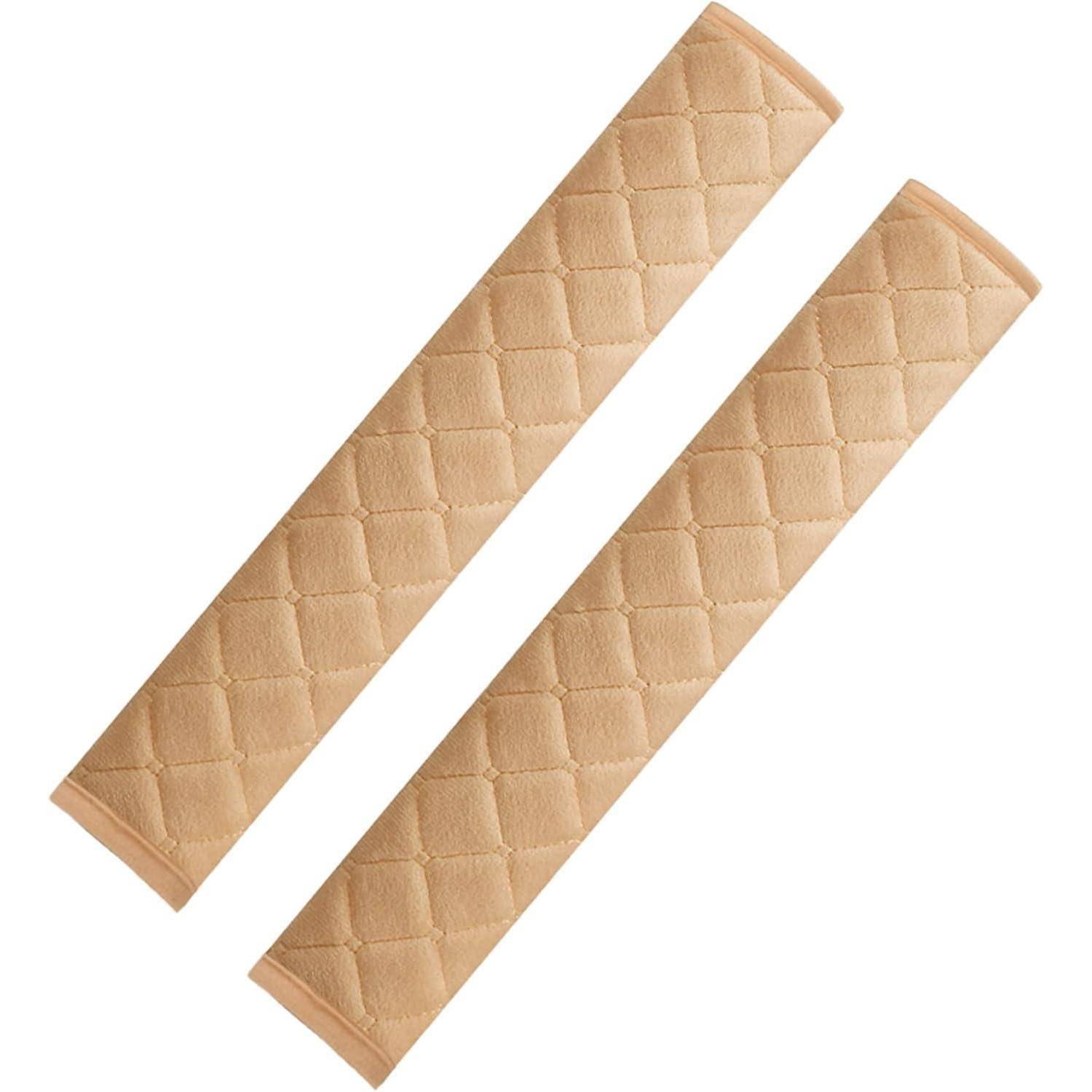 Zwei beige gesteppte Ärmelschützer diagonal auf weißem Hintergrund angeordnet.