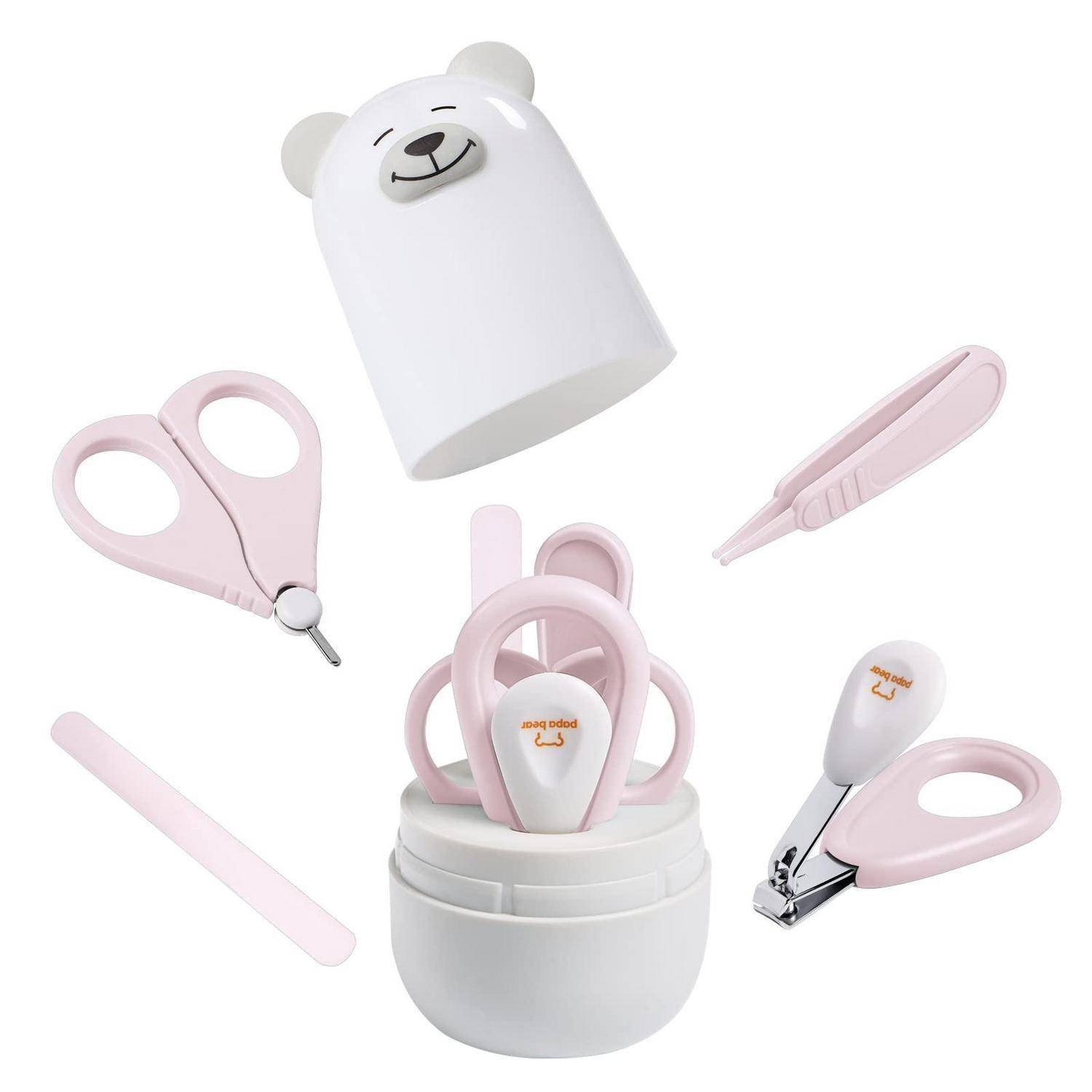 Set von Babynagelpflegezubehör in Rosa und Weiß, einschließlich Schere, Pinzette, Feile, Nagelknipser und Aufbewahrungsbox mit Bärenmotiv-Abdeckung.