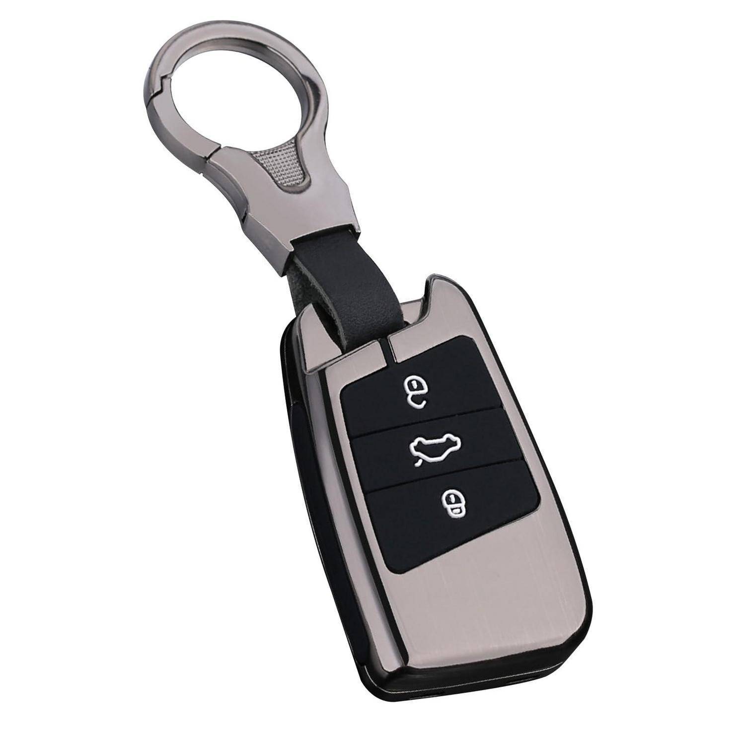 Autoschlüsselbund mit drei Tasten zum Verriegeln, Entriegeln und zum Öffnen des Kofferraums, befestigt an einem Metallringclip.