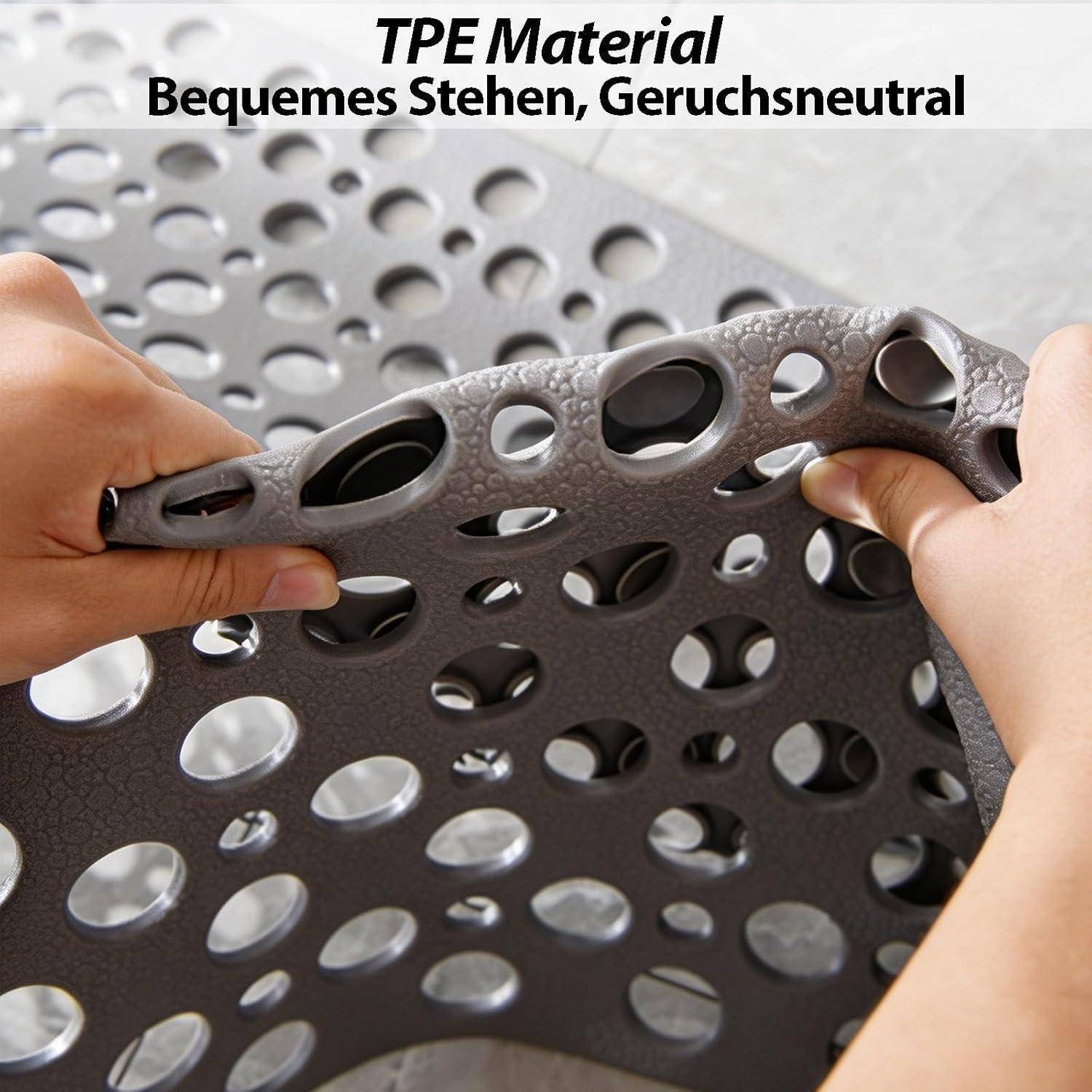 Hände dehnen und beugen ein perforiertes graues TPE-Materialmuster; Text sagt "TPE-Material"" und ""Bequemes Stehen, Geruchsneutral"".