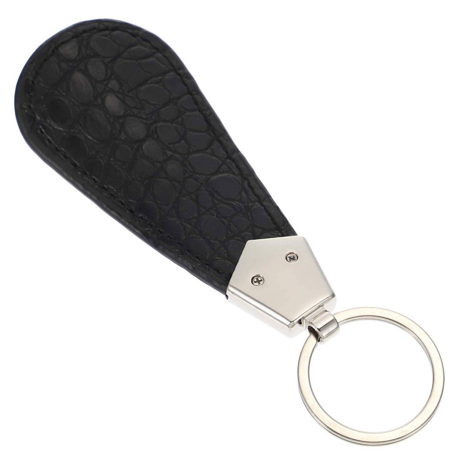 Schwarzes tropfenförmiges Leder-Schlüsselanhänger mit Metallschlüsselring auf weißem Hintergrund.