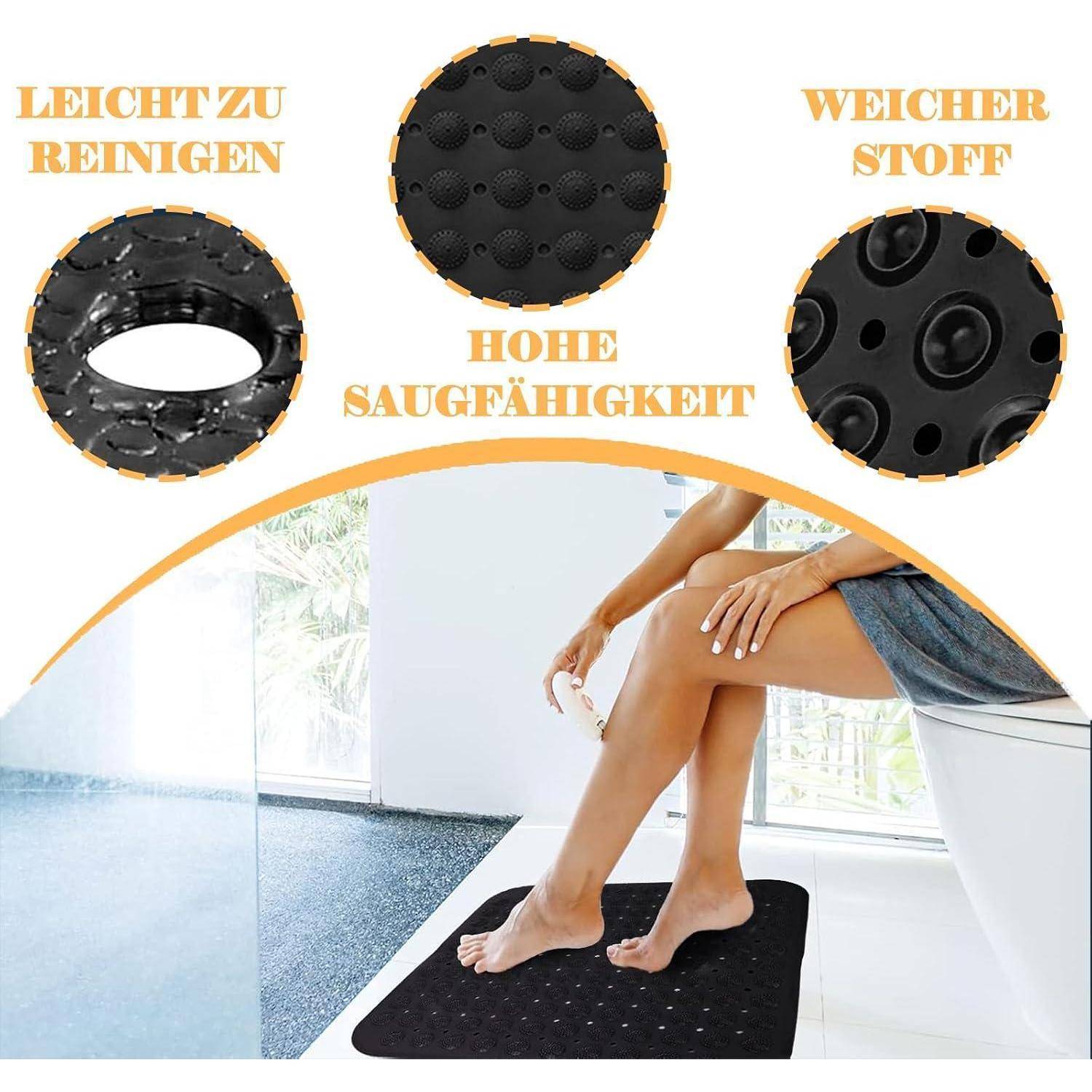 Werbebild einer schwarzen, strukturierten Badematte mit Saugnapfeln, die unter den Füßen einer sitzenden Person gezeigt wird und leichte Reinigung, weiches Material und hohe Saugfähigkeit hervorhebt.