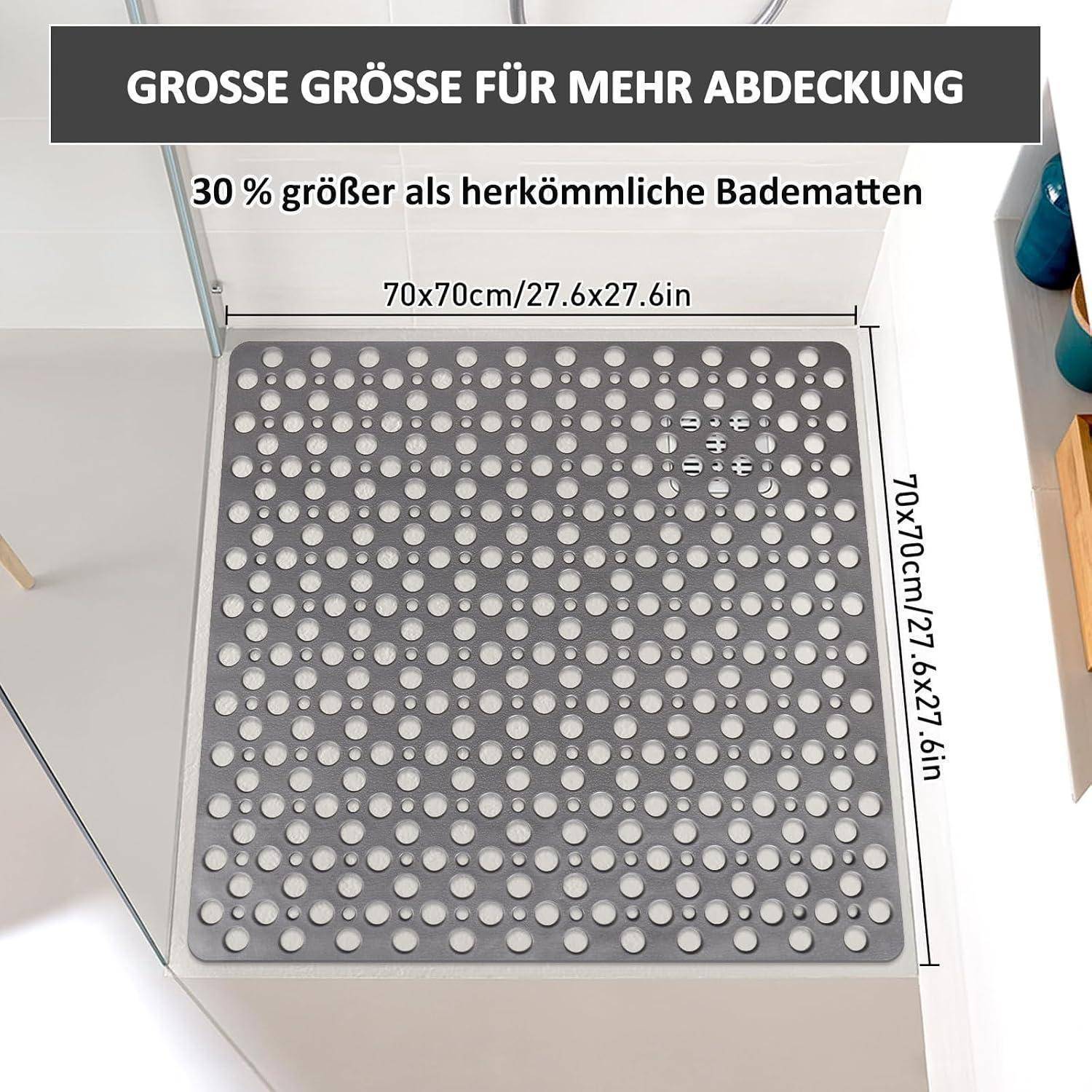 Graue 70 x 70 cm Badematte mit Entwässerungslöchern, dargestellt als 30% größer als Standard-Matten, mit Größenbezeichnungen in Deutsch und Englisch.