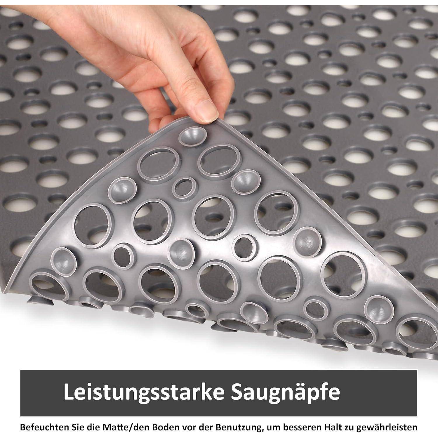 Hand hebt eine perforierte Saugmatte mit vielen erhabenen Saugnäpfen an; deutsche Beschriftung sagt „Leistungsstarke Saugnäpfe