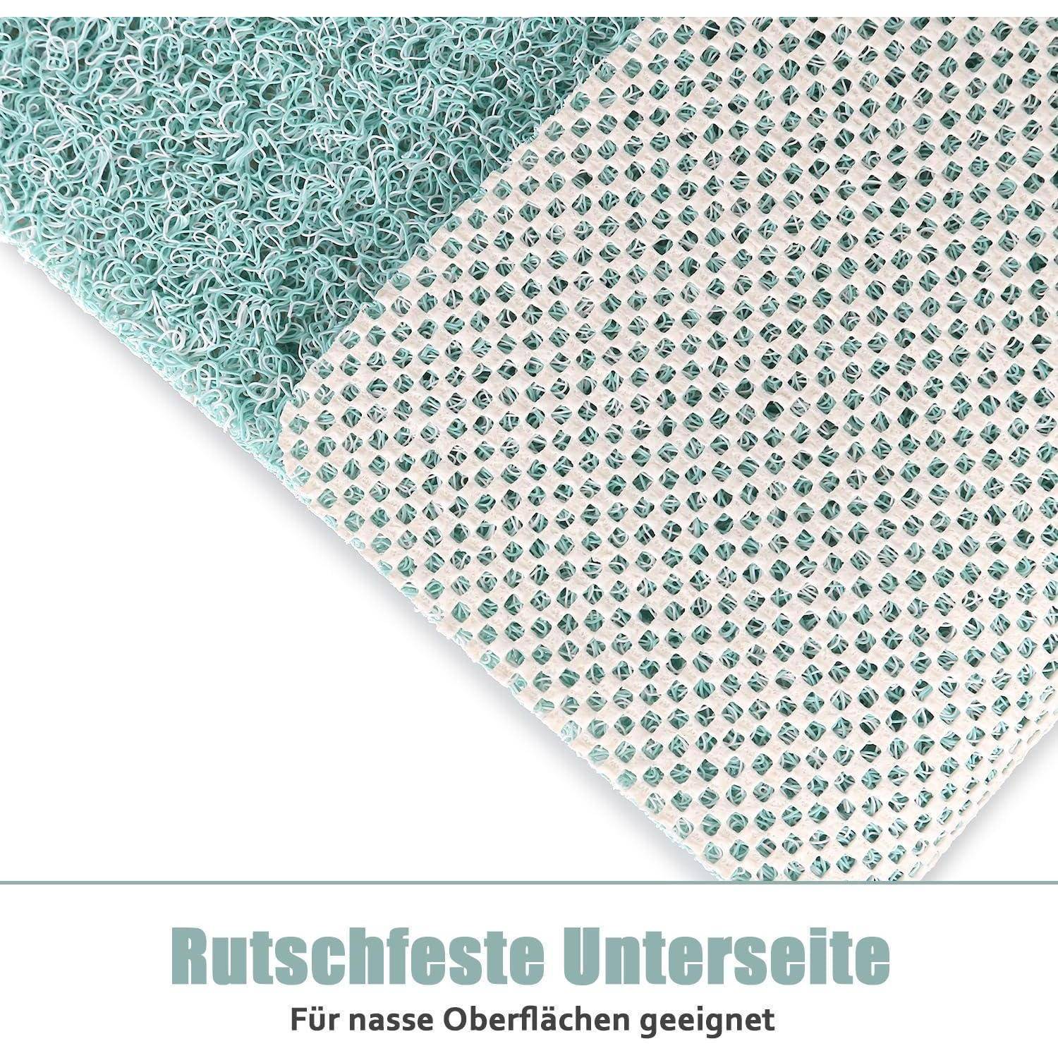 Nahaufnahme einer Matte mit strukturierter rutschfester Unterseite und deutschem Text „Rutschfeste Unterseite