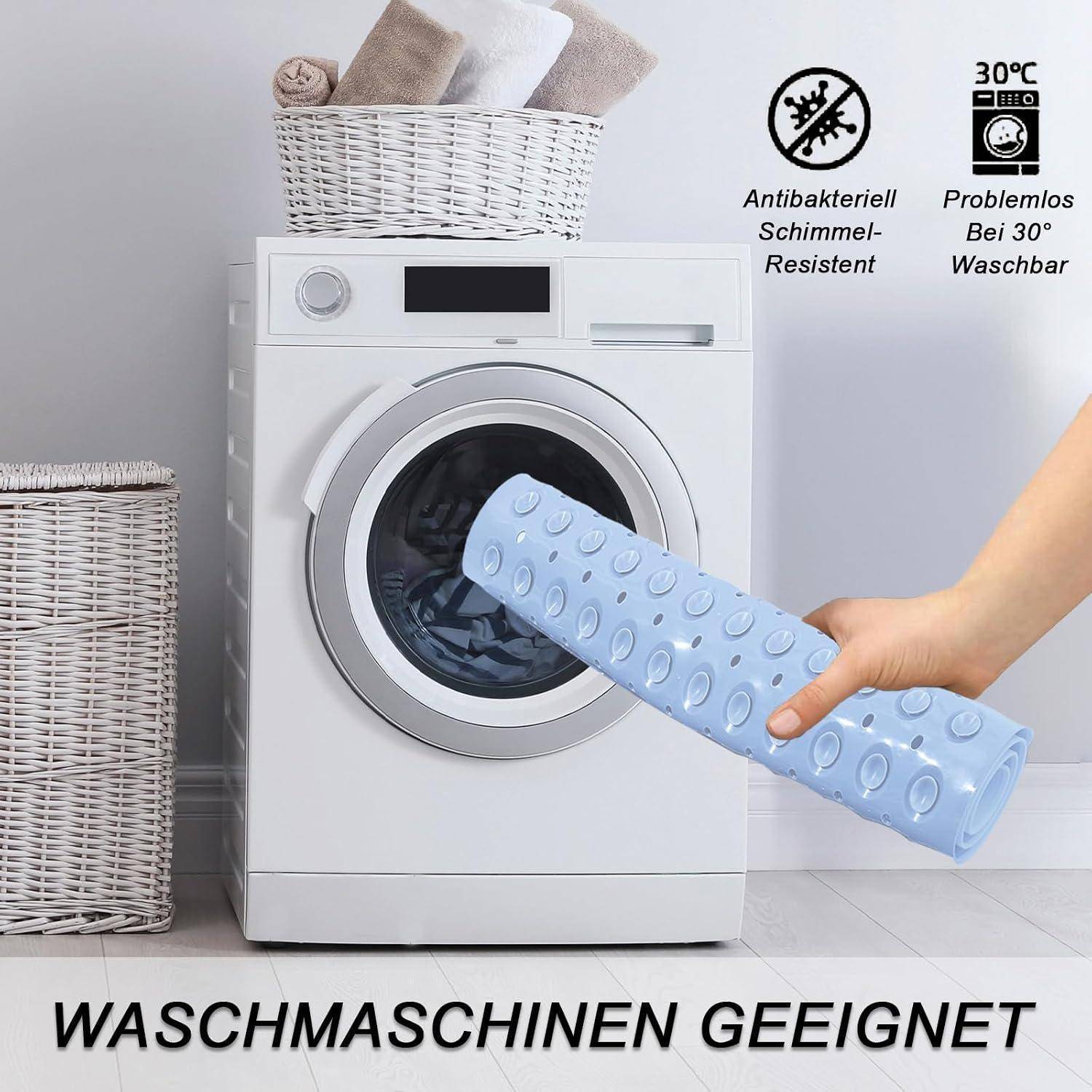 Hand hält eine blaue Antirutschmatte vor einer Frontladewaschmaschine; Text besagt „WASCHMASCHINEN GEEIGNET