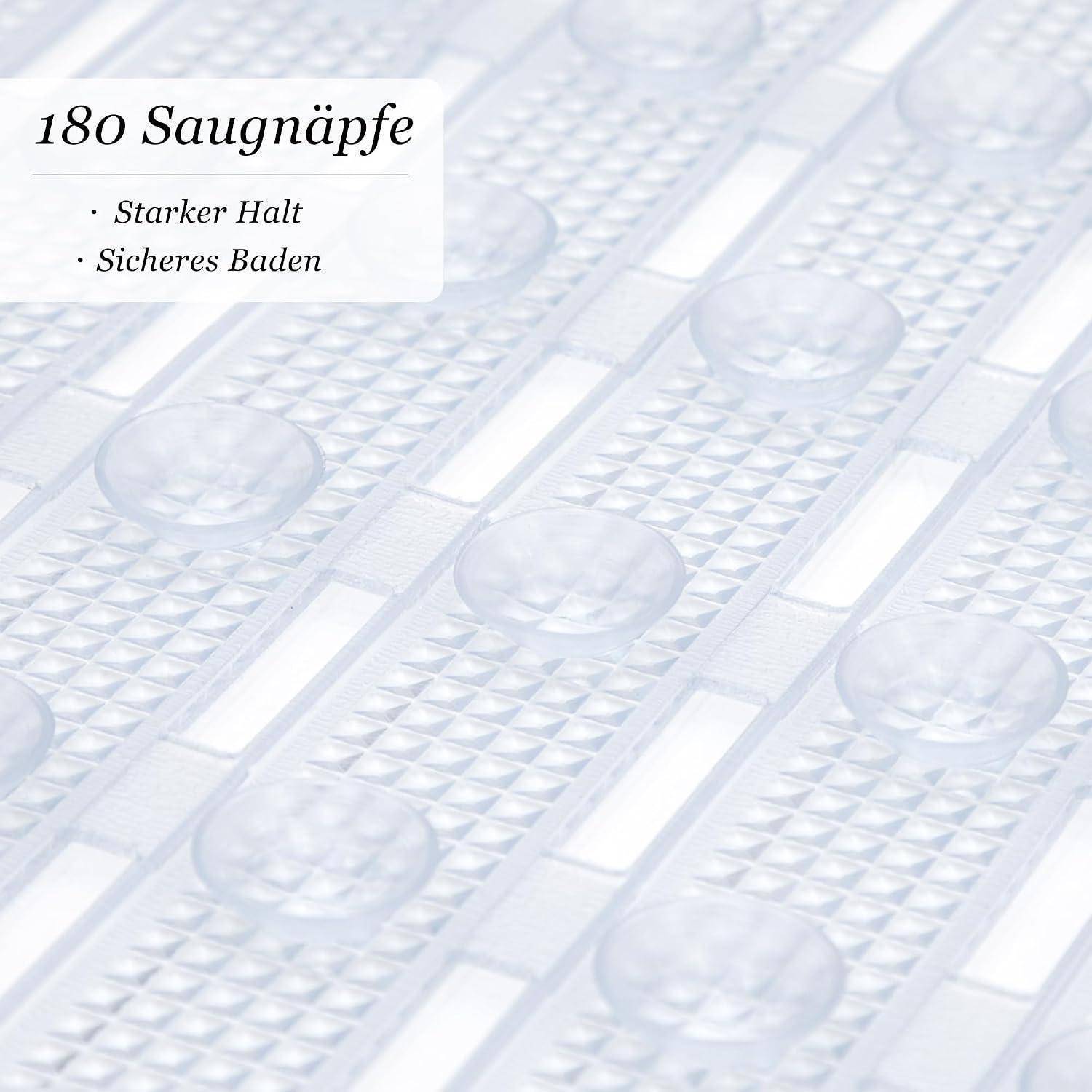 Nahaufnahme einer strukturierten Saugmatte mit runden Saugnäpfen; Text besagt „180 Saugnäpfe" und „Starker Halt, Sicheres Baden"" und deutet auf festen Griff für sicheres Baden hin.