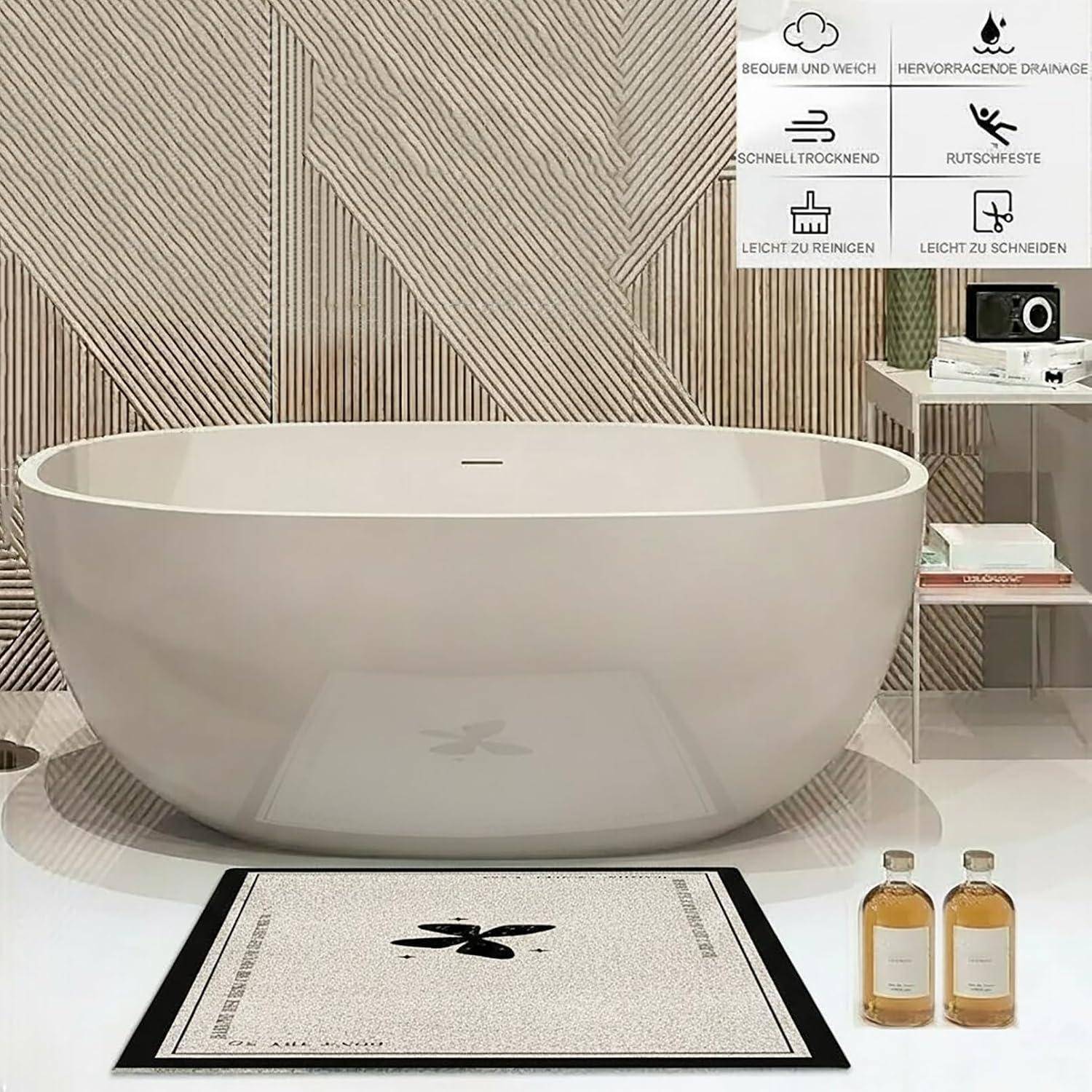 Minimalistisches Badezimmer-Waschbecken mit ovalem, mattweiß glänzendem Becken auf einer Arbeitsplatte, sowie eine kleine Produktmatte und zwei Flaschen. Premium-Funktionen werden in deutschen Symbolen dargestellt.