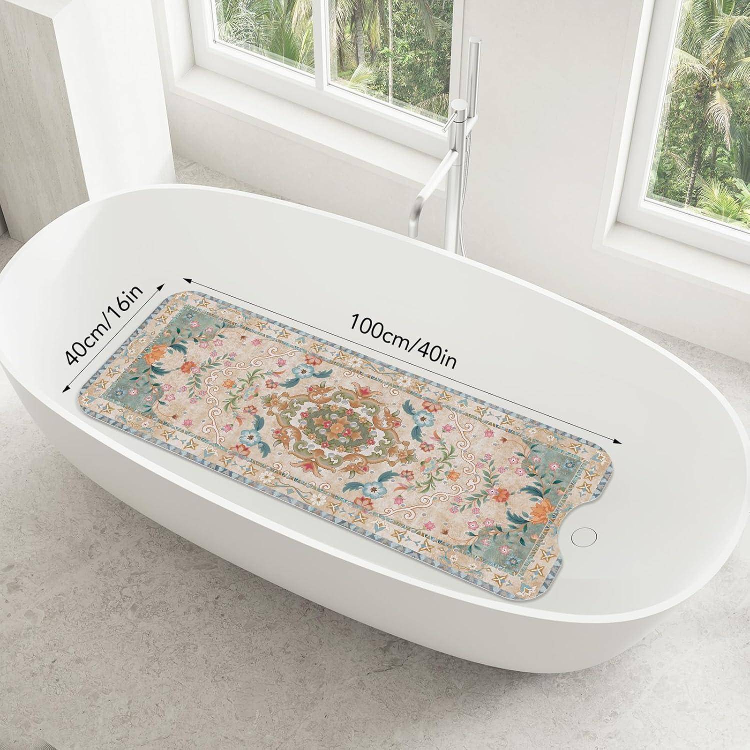 Rechteckige Badematte mit Blumenmuster auf einer weißen ovalen Badewanne, gekennzeichnet mit 100 cm/40 Zoll Länge und 40 cm/16 Zoll Breite.