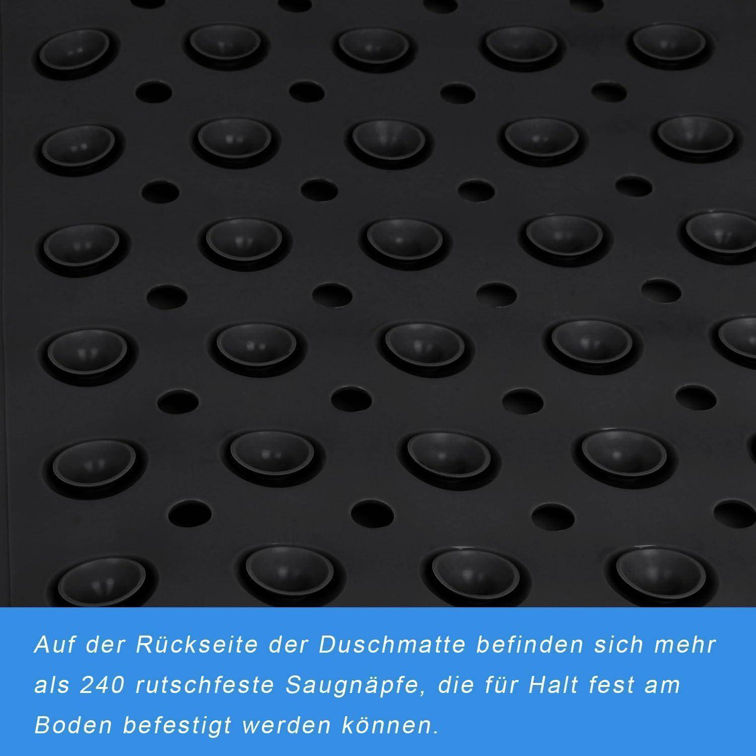 Nahaufnahme der Unterseite einer schwarzen Duscheinlage mit Reihen von Saugnapfbechers und Löchern; deutscher Text besagt, dass sie über 240 rutschfeste Saugnapfbecher für sichere Bodenhaftung hat.