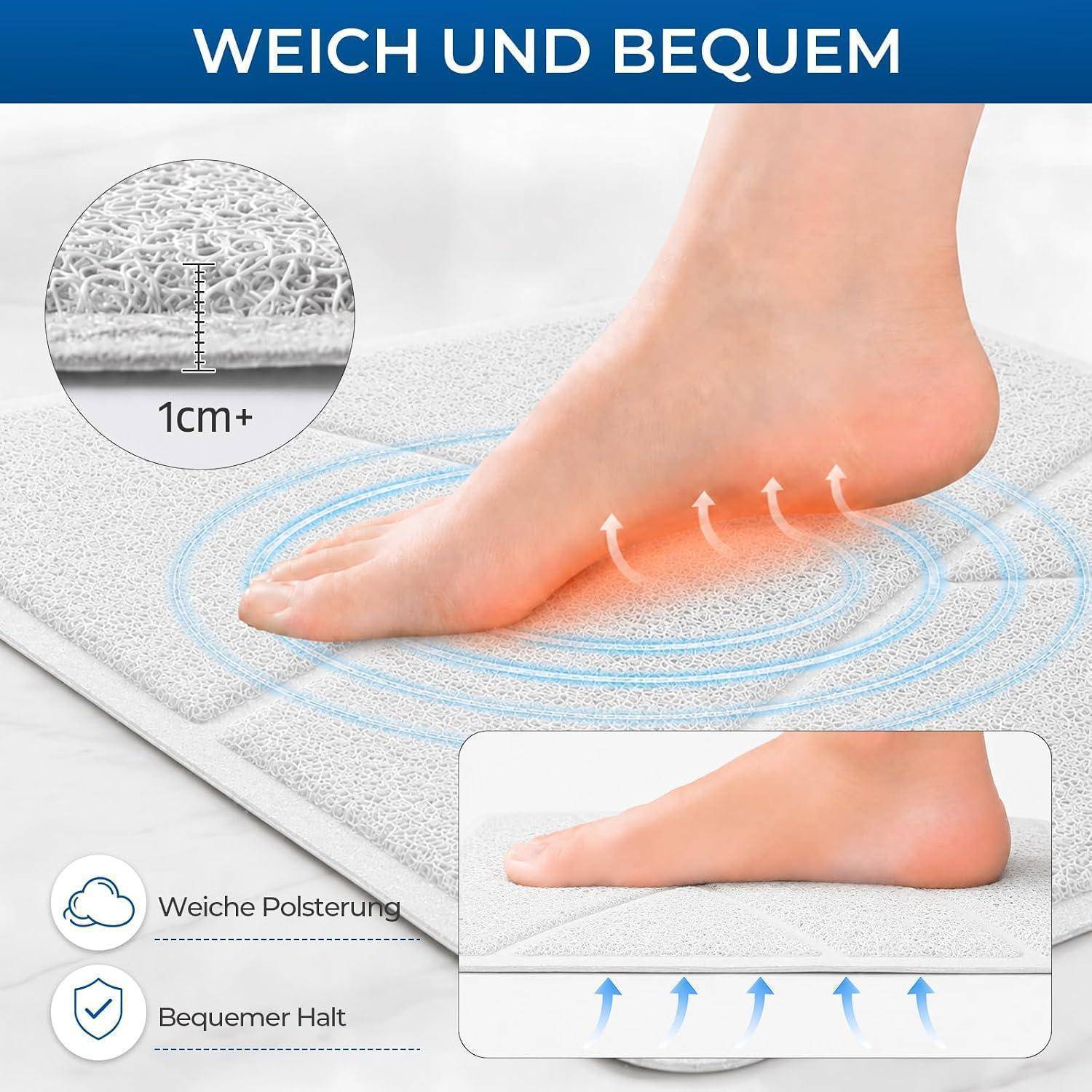Fuß auf einer gepolsterten Matte mit der Aufschrift „WEICH UND BEQUEM"; Ausschnitt zeigt über 1 cm dicke Polsterung und Symbole für weiches Polster und komfortable Griffigkeit.