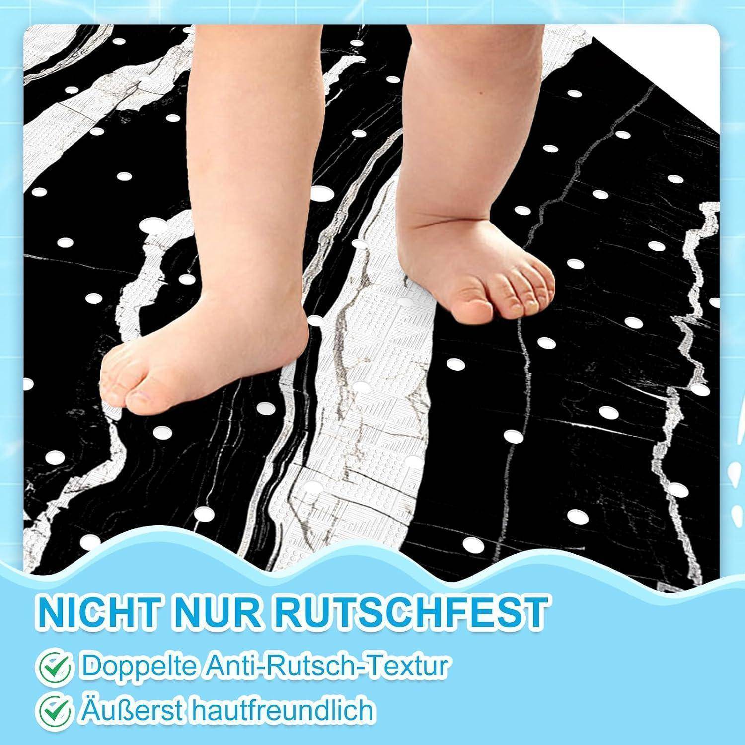 Babyfüße auf einer schwarz-weißen rutschfesten Matte; deutscher Text sagt „NICHT NUR RUTSCHFEST