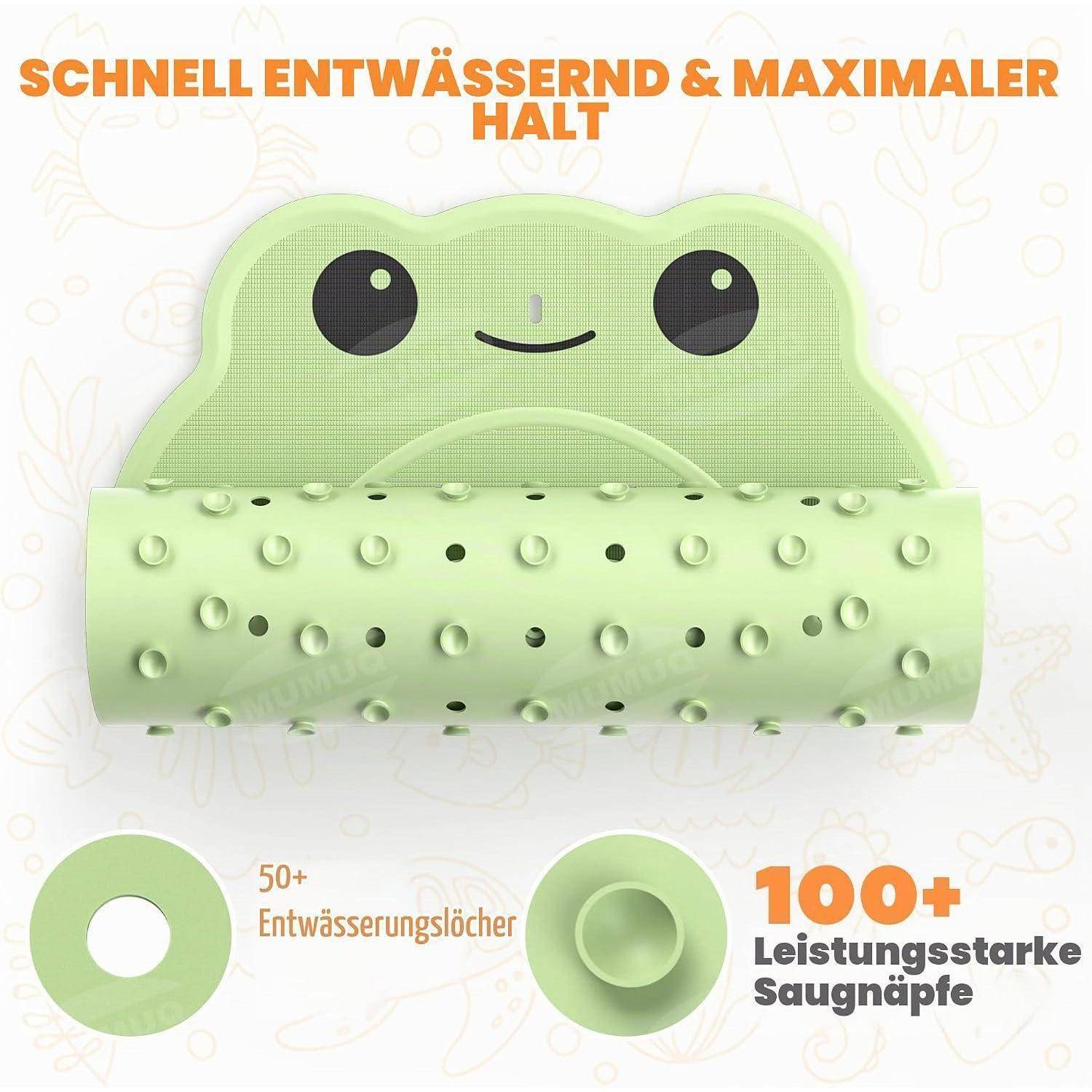 Grüner froschförmiger Badteppich mit Saugnäpfen und Entwässerungslöchern, mit der Beschriftung 