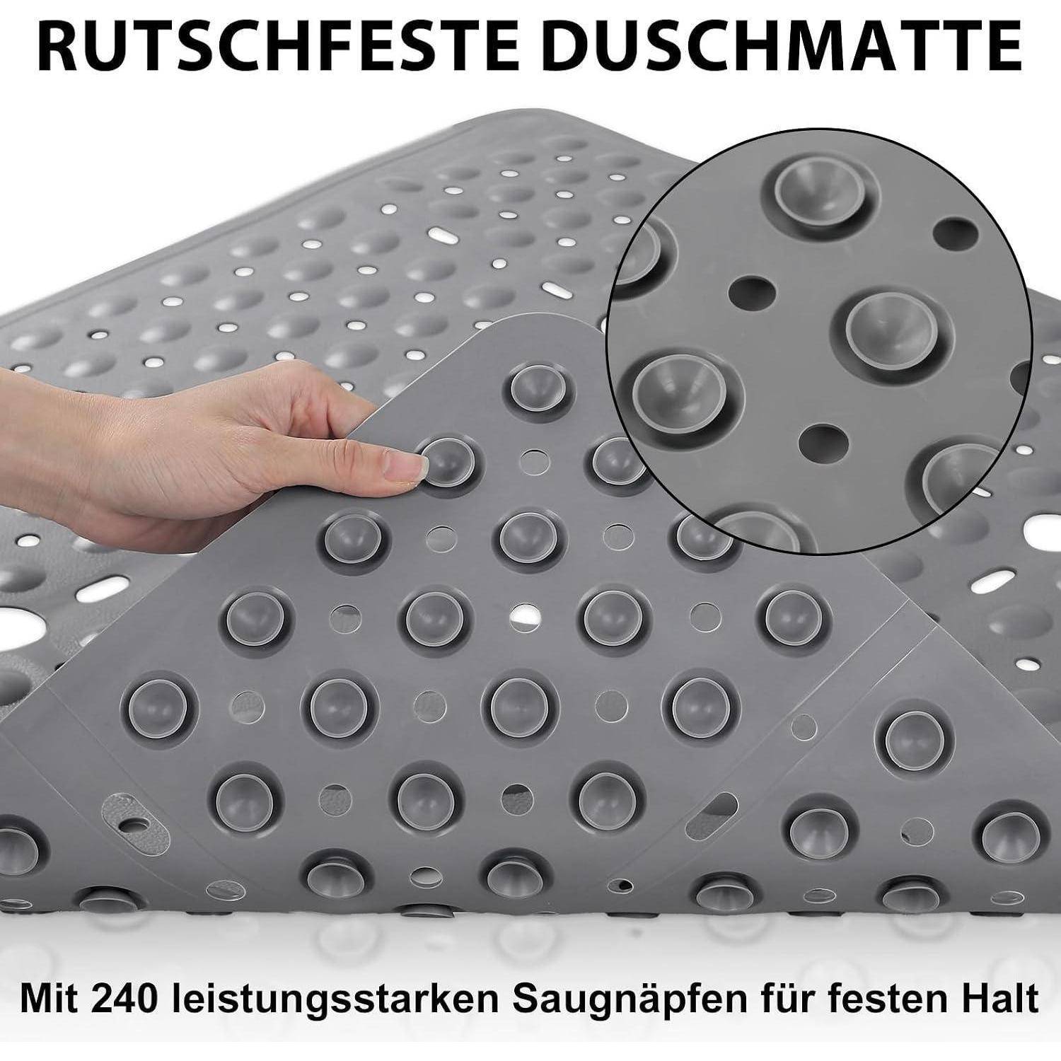 Graue rutschfeste Badematte, die von einer Hand gehalten wird, mit vielen Saugnäpfen; der Text lautet „RUTSCHFESTE DUSCHMATTE