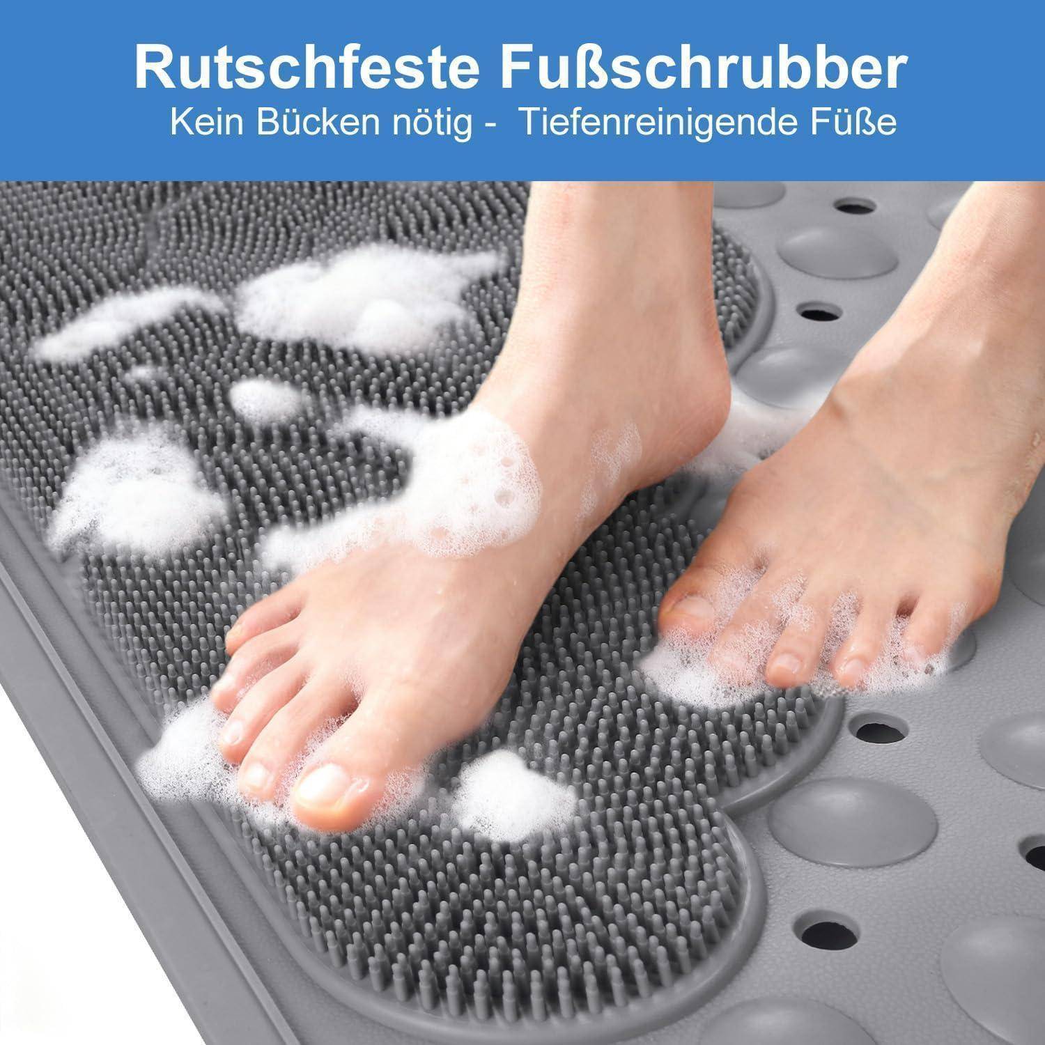 Fußwäsche auf einer grauen rutschfesten Schrubmatte mit Seifenschaum; der deutsche Text sagt „Rutschfester Fußreiniger
