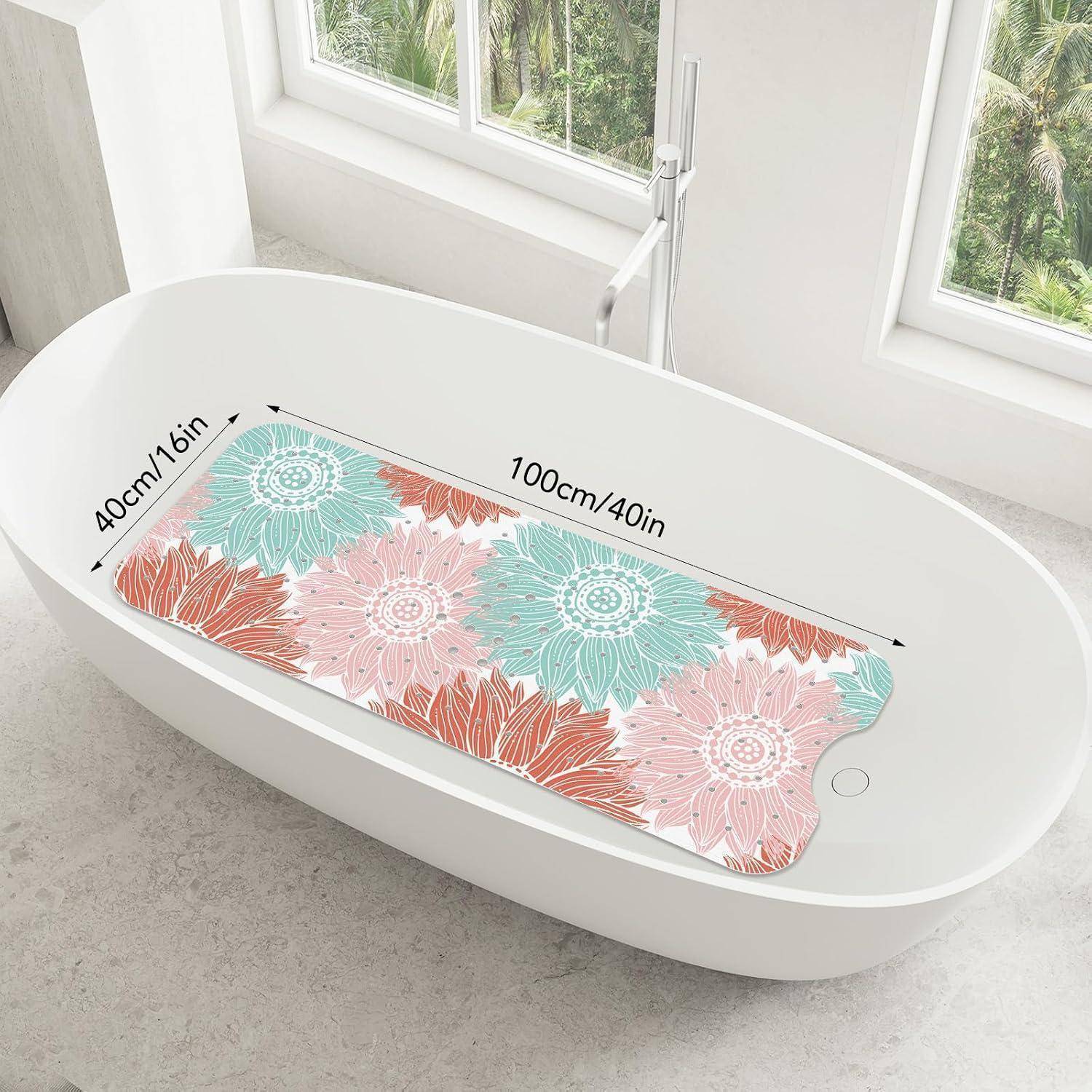 Weiße ovale Badewanne mit einer bunten Blumen-Antirutschmatte mit der Bezeichnung 100 cm/40 Zoll x 40 cm/16 Zoll.