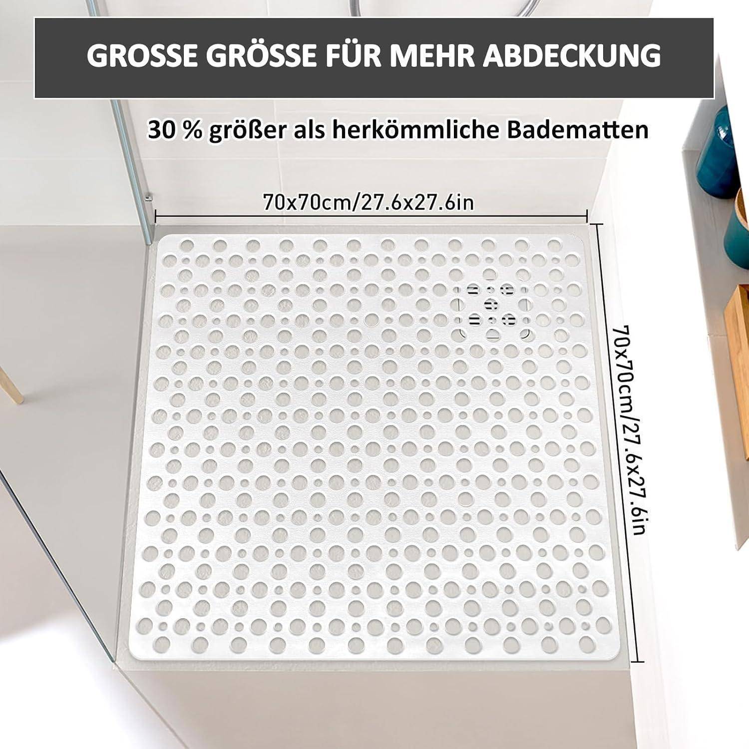 Quadratische weiße Badematte mit Lochung, gezeigt in einer Dusche, mit der Bezeichnung 70 x 70 cm und „30% größer als herkömmliche Matten