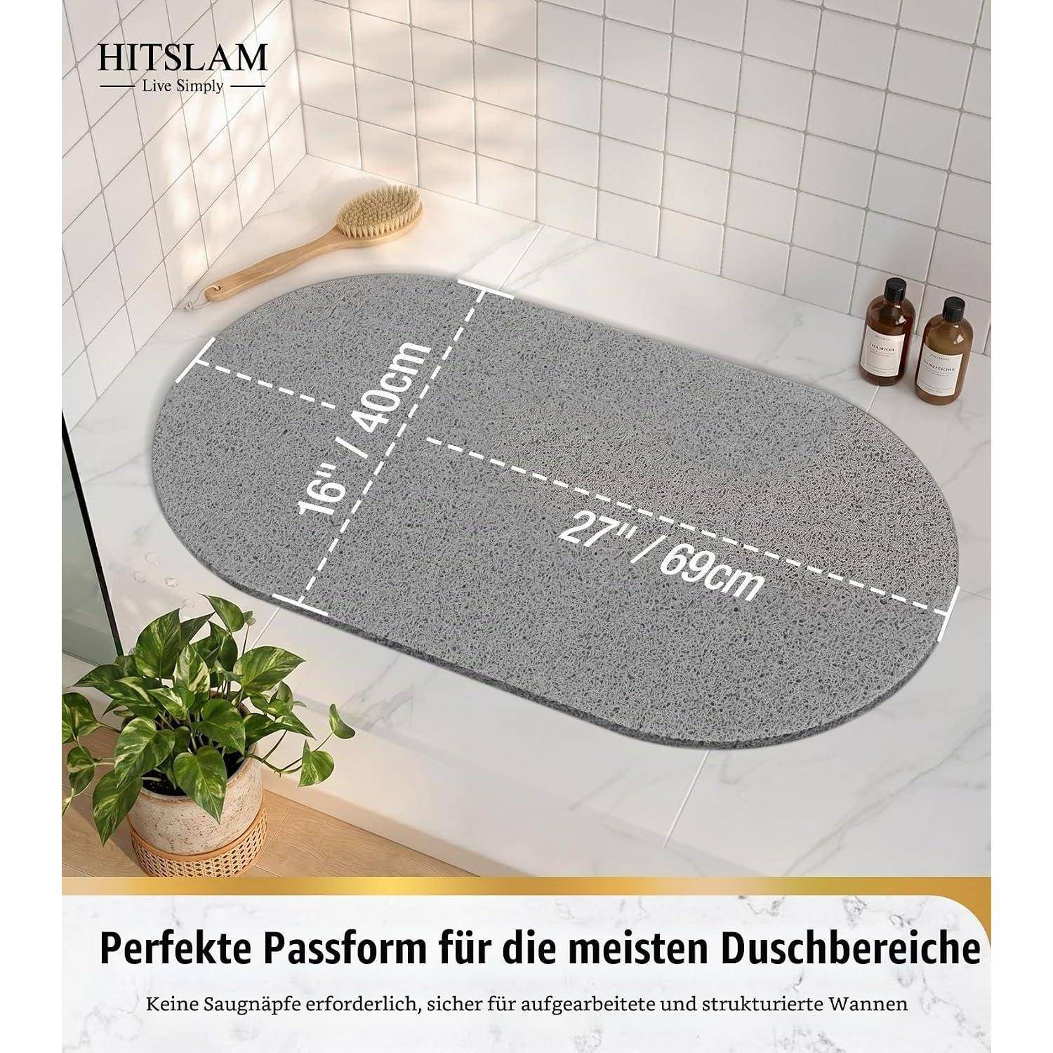 Graue ovale Badematte in einem Duschbereich gezeigt, gekennzeichnet mit 16" x 40"" und 27"" x 69 cm, beworben als passend für die meisten Duschräume.