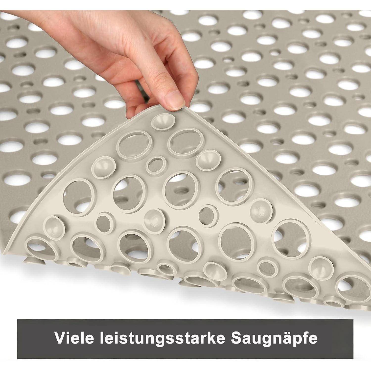 Hand hebt eine perforierten Saugnapf-Matte; die Beschriftung lautet „Viele leistungsstarke Saugnäpfe
