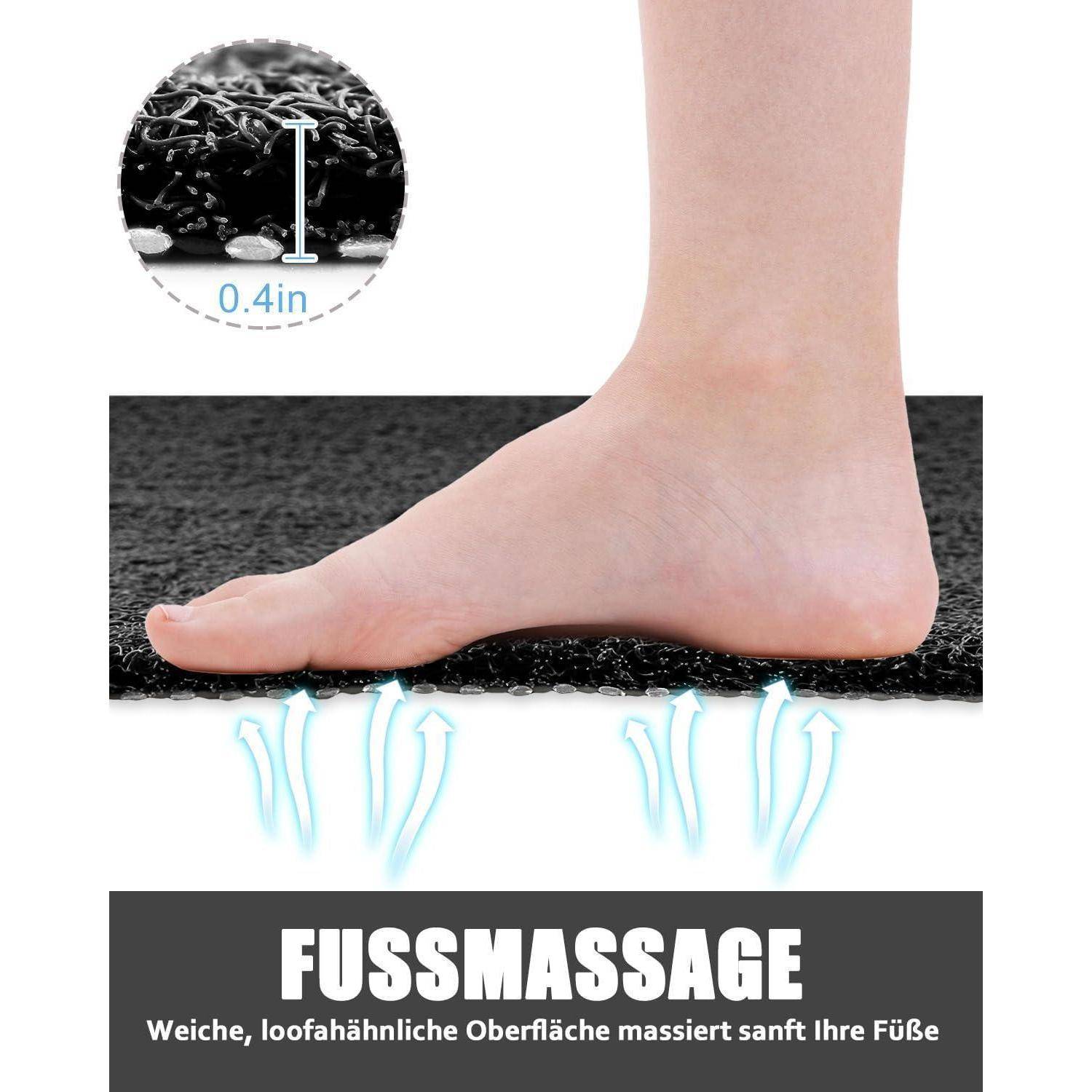 Produktabbildung eines Fußes auf einer 1 cm dicken schwarzen Massagematte mit der Bezeichnung „FUSSMASSAGE", die eine weiche, schaumstoffartige Oberfläche zeigt, die die Füße sanft massiert.