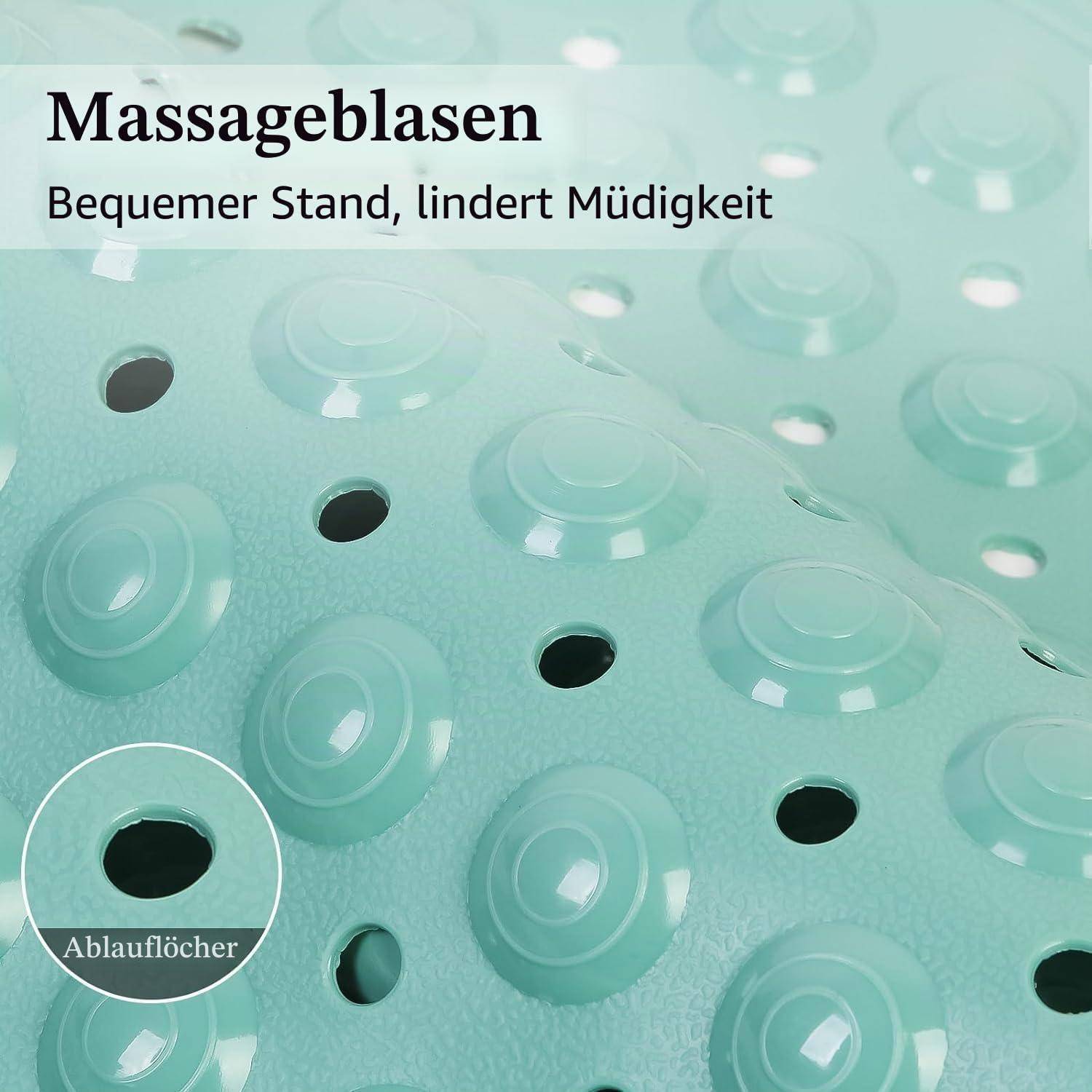 Mintgrüne Massagematte mit erhabenen Kreisen und Ablauflöchern, beschriftet mit „Massageblasen" und „Bequemer Stand, lindert Müdigkeit""; eine Nahaufnahme zeigt die „Ablauflöcher"" hervorgehoben.