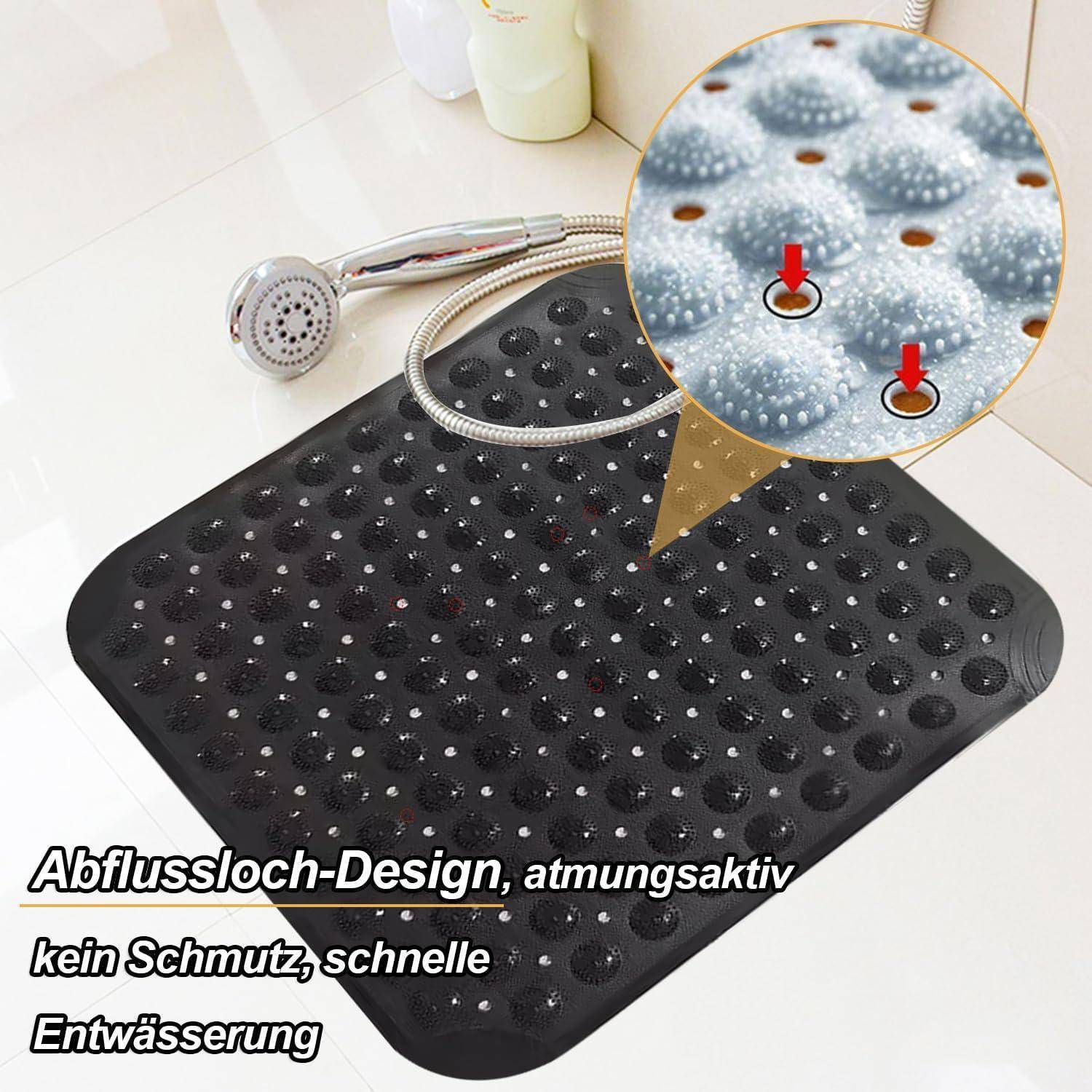 Schwarze strukturierte Badematte mit vielen Abflusslöchern und Saugnäpfen, gezeigt mit einer Handbrause; Text sagt „Abflussloch-Design, atmungsaktiv, kein Schmutz, schnelle Entwässerung