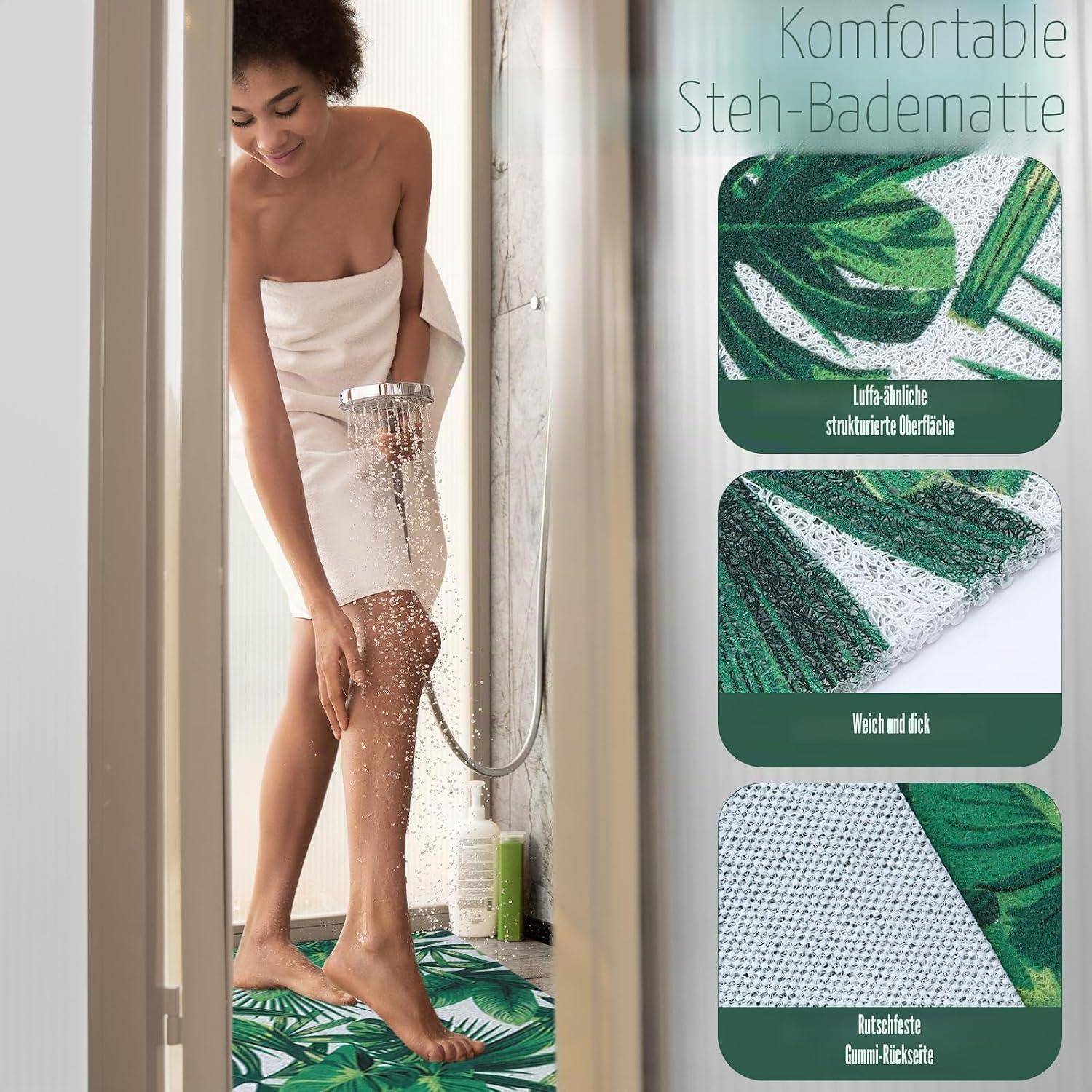 Frau unter der Dusche auf einer grünen gemusterten Badmatte; der Werbetext lautet „Komfortable Steh-Badematte