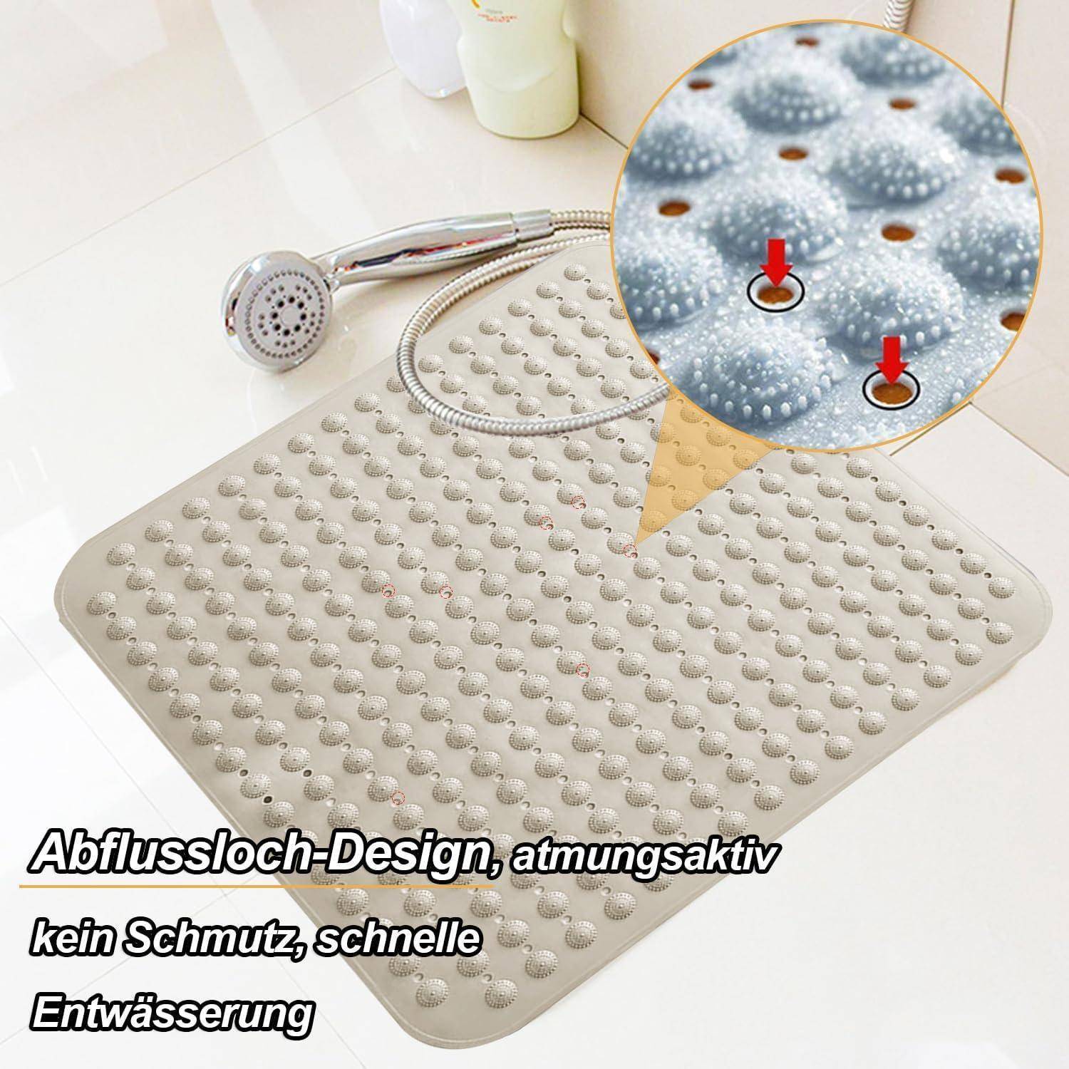 Strukturierte beige Badewannenmatte mit vielen Saugnäpfen und Ablöchern; vergrößerte Detailaufnahme zeigt das Entwässerungsdesign für schnelle Wasserableitung.