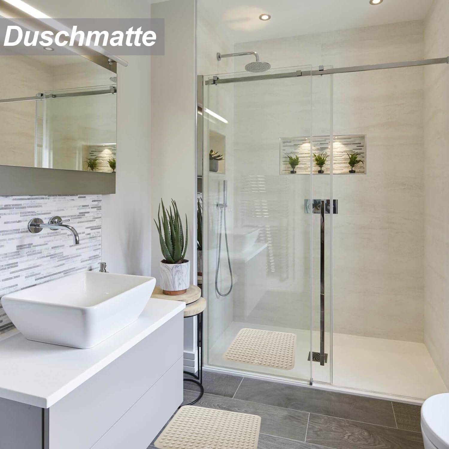 Modernes Badezimmer mit begehbarer Glasdusche, schwebendem Waschbeckenunterschrank, Wandspiegel und grauem Fliesenboden.