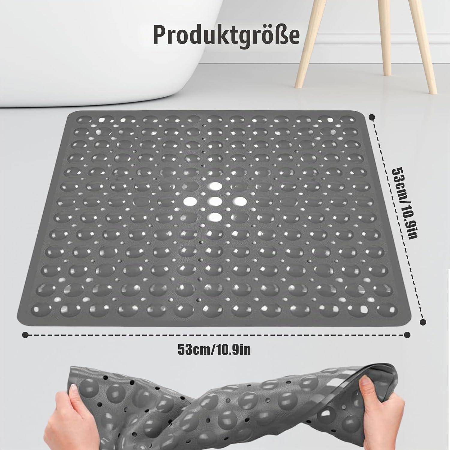 Graue strukturierte Badewannenmatte mit Produktgröße von 53 cm x 53 cm, und Hände demonstrieren, dass sie flexibel und faltbar ist.