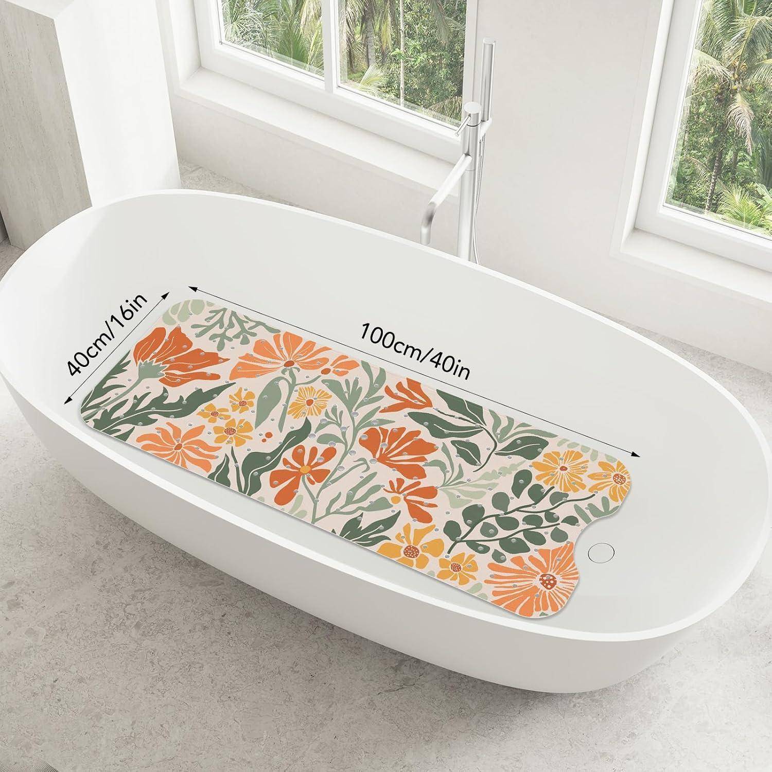 Ovale Badewanne mit blumenmuster-Rutschsicherheitsmatte, beschriftet 100cm/40in lang und 40cm/16in breit, in einem hellen Badezimmer platziert.