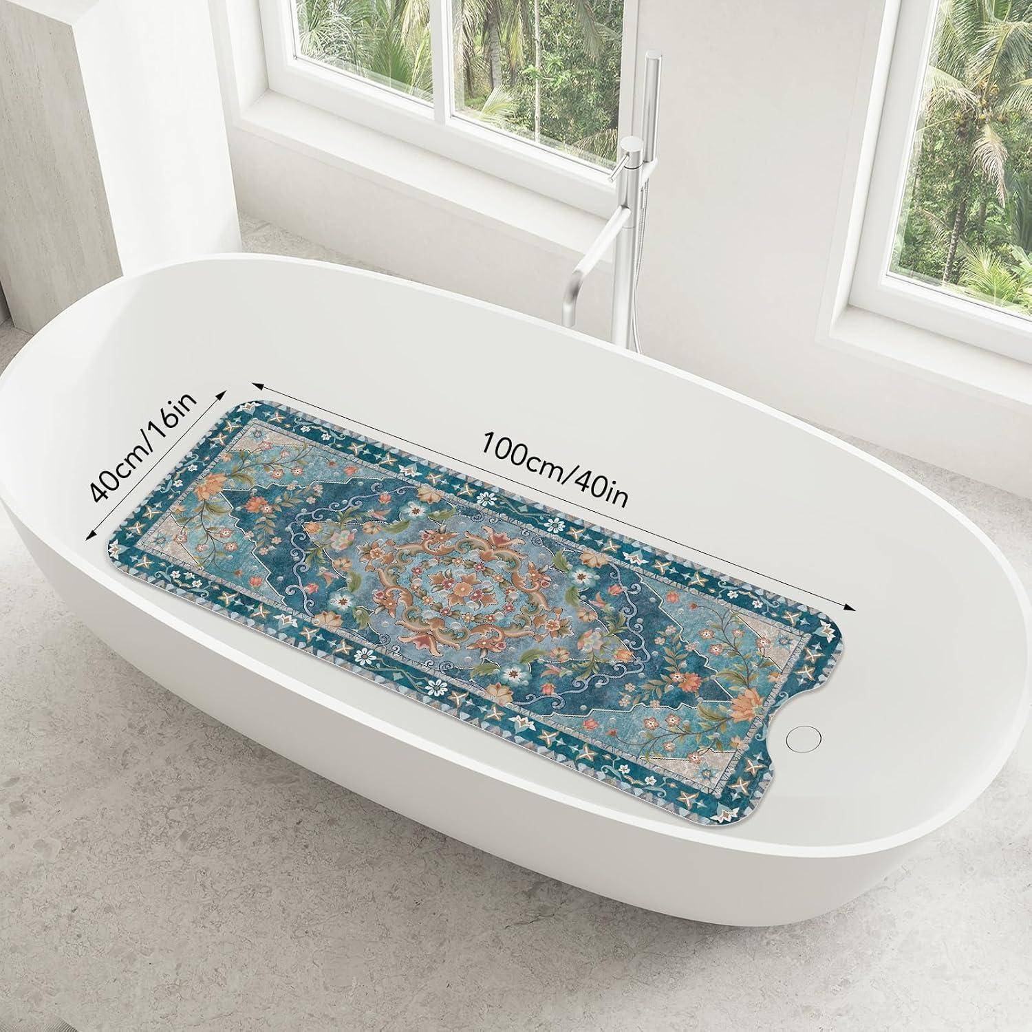 Ovale Badewanne mit einer dekorativen rechteckigen Badematte auf der Oberseite, mit der Beschriftung 100 cm/40 Zoll lang und 40 cm/16 Zoll breit.