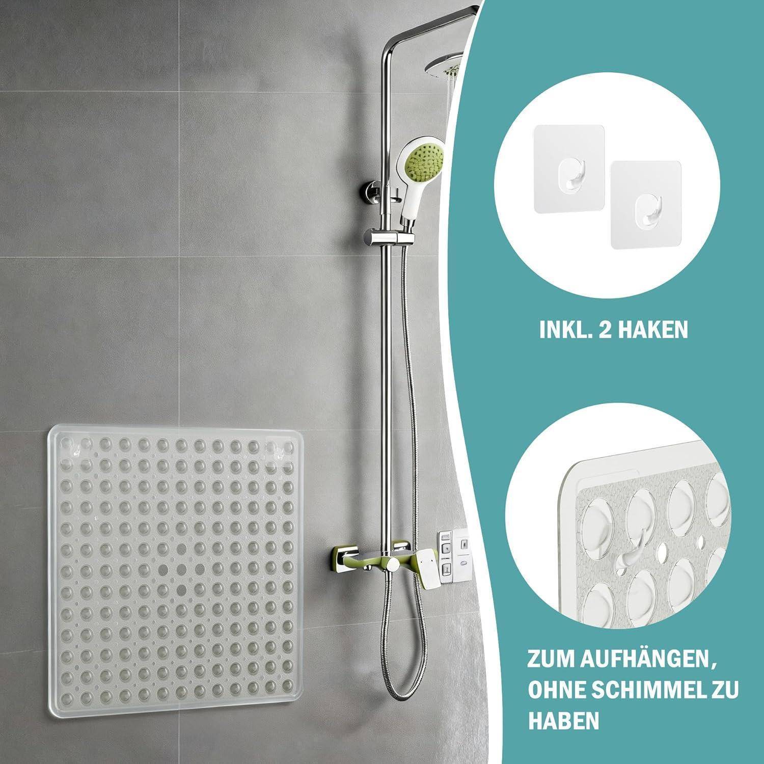 Badezimmerszene mit einer an der Wand angebrachten Dusch-Aufbewahrungsmatte und tragbarem Duschkopf; Produktbeschriftungen sagen „INKL. 2 HAKEN