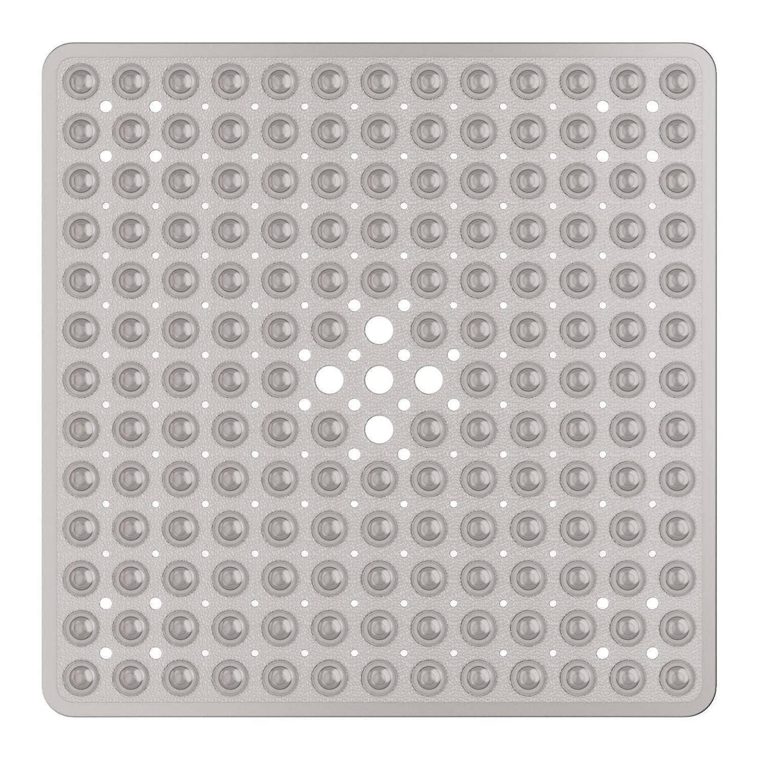 Graues quadratisches Tastplättchen mit erhabenen kreisförmigen Noppen und einem zentralen rautenförmigen Muster aus glatten Punkten, wahrscheinlich eine Blindenschrift- oder Navigationshilfe.