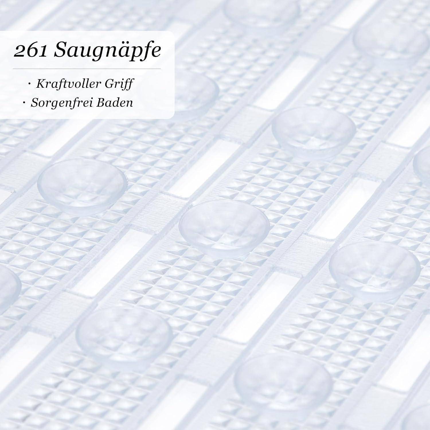 Deutsches Produktbild von durchsichtigen Saugnäpfen auf einer strukturierten Badematte, beschriftet mit „261 Saugnäpfe" mit den Angaben „Kraftvoller Griff"" und „Sorgenfrei Baden"