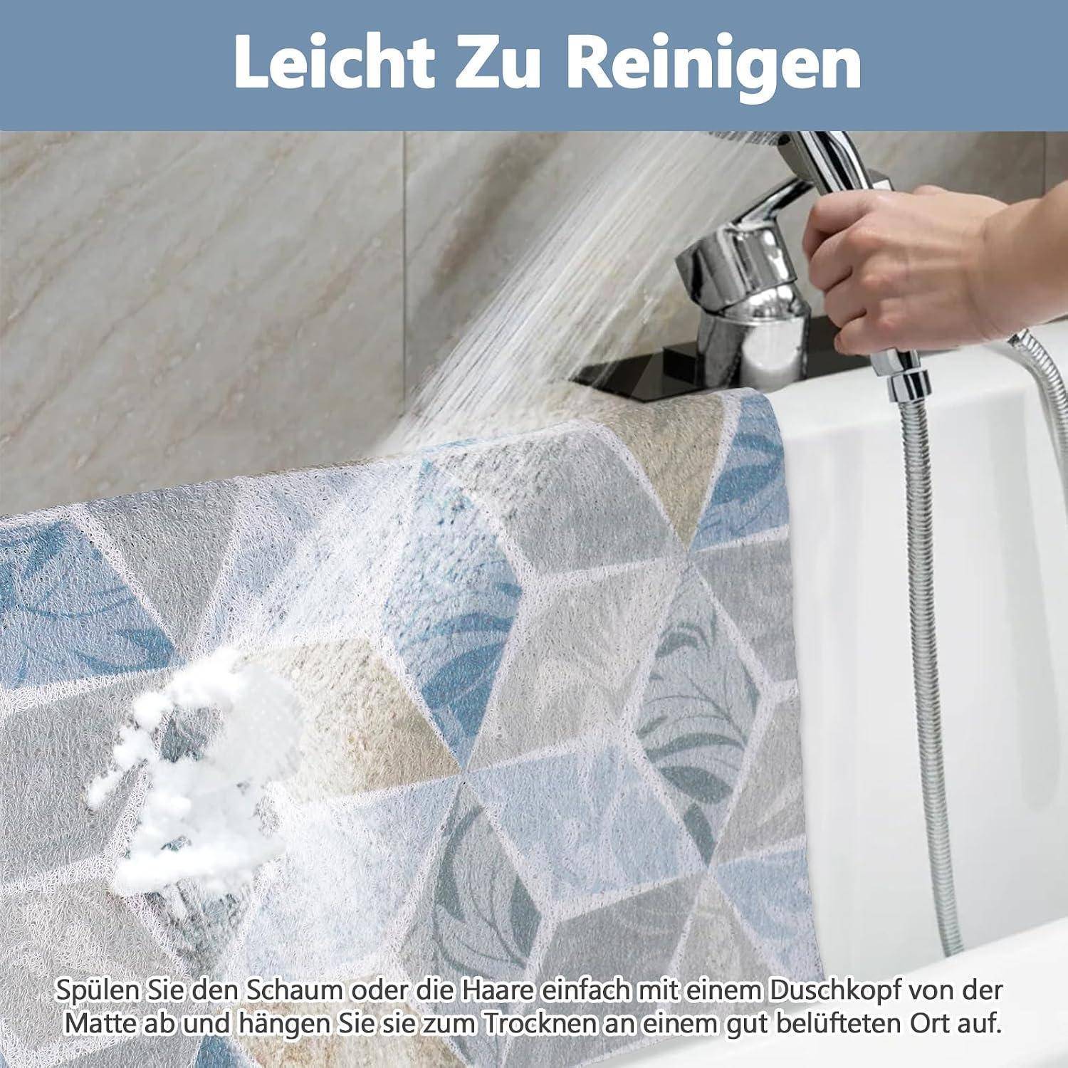 Deutsches Werbeplakat, das eine Hand zeigt, die eine Badewannenmatte mit einem Duschkopf abspült; der Text besagt „Leicht zu reinigen" und deutet darauf hin, dass Schaum oder Haare abgewaschen werden können und das Material an einem belüfteten Ort getrocknet werden kann.