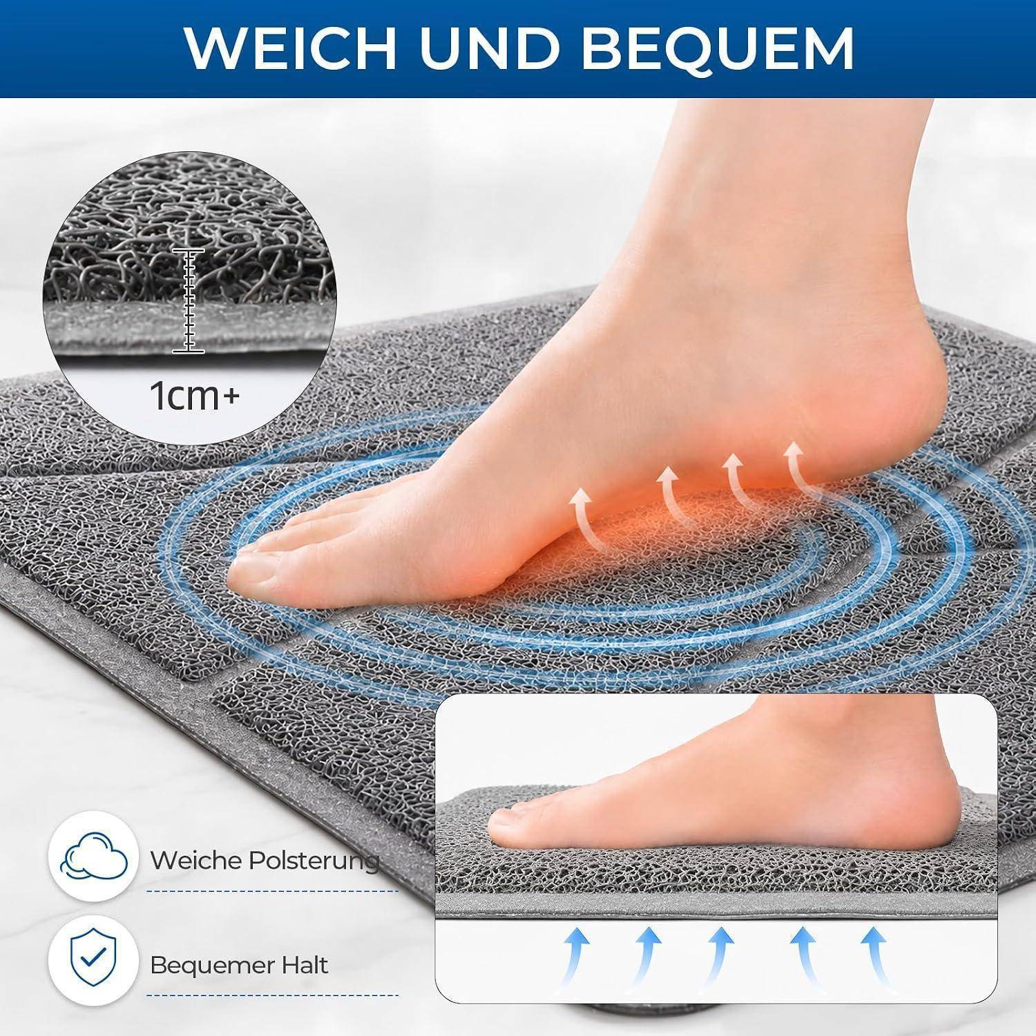 Fuß drückt auf eine graue gepolsterte Matte und zeigt weiches Abstützen und Komfort; deutscher Text sagt „weich und bequem" und „1cm+"" Polsterung.