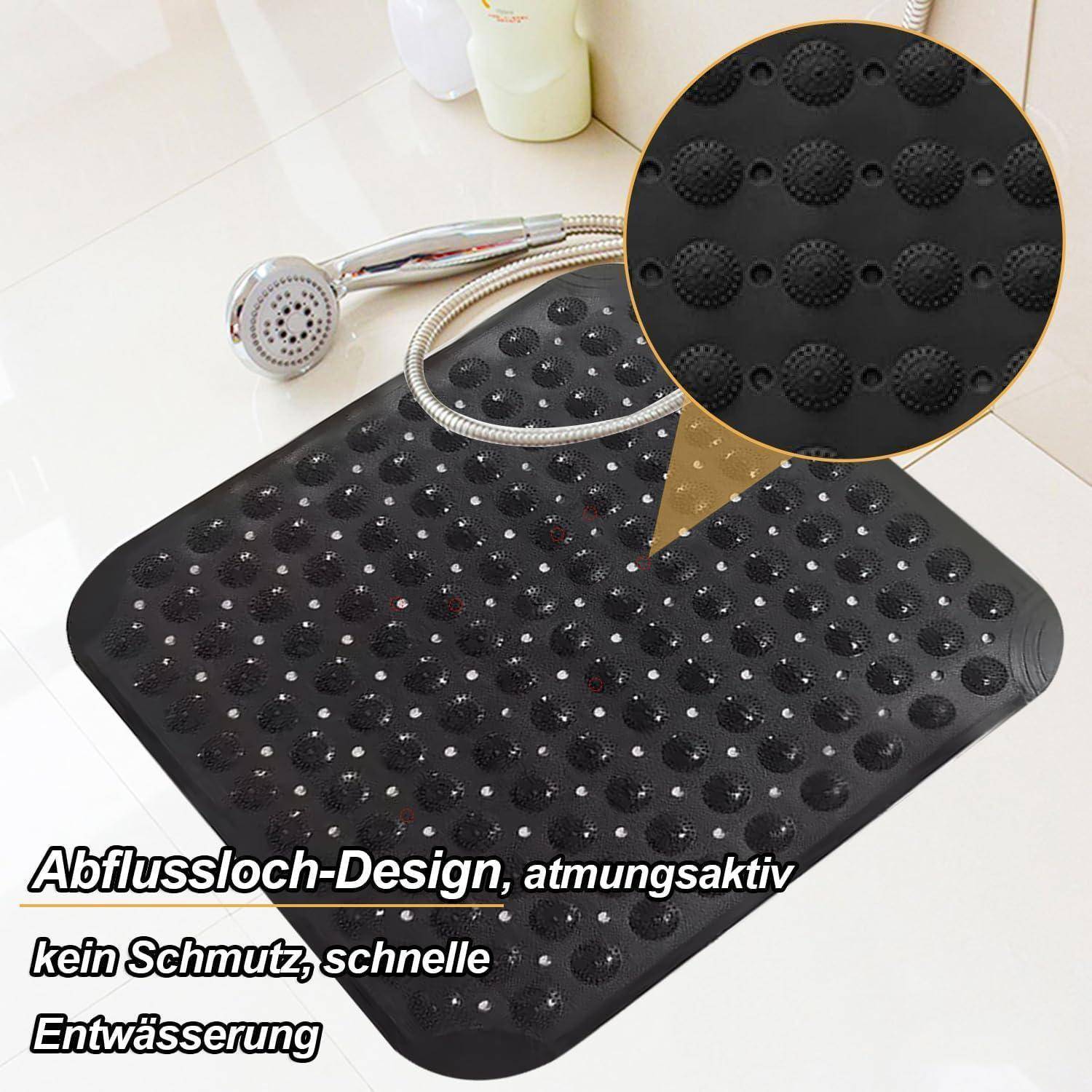 Schwarze rutschfeste Badematte mit Saugnapfen und Abflusslöchern, gezeigt mit Handbrause; deutscher Text besagt 