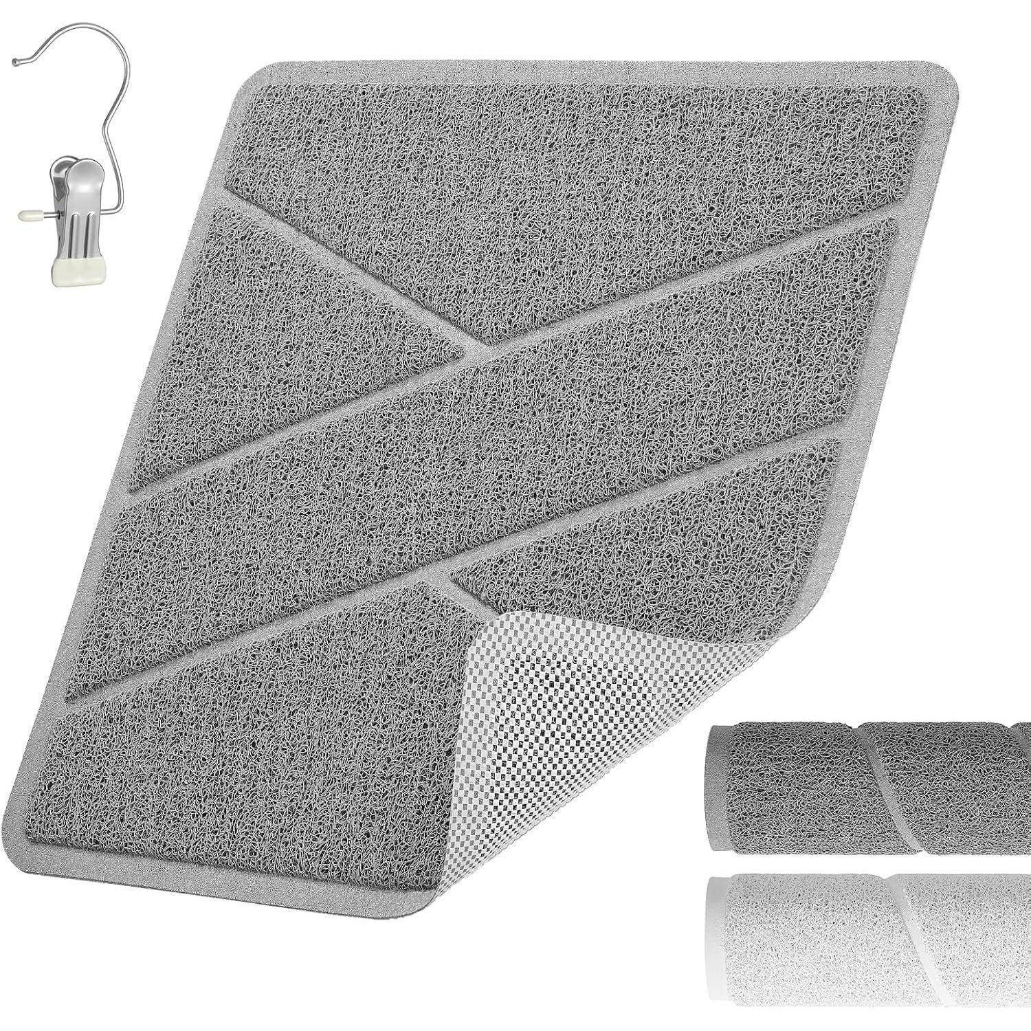 Graue strukturierte Türmatte mit Peel-and-Stick-Rückseite, gezeigt mit einem Metallclip und gerollten Wechselfarben in der Ecke.