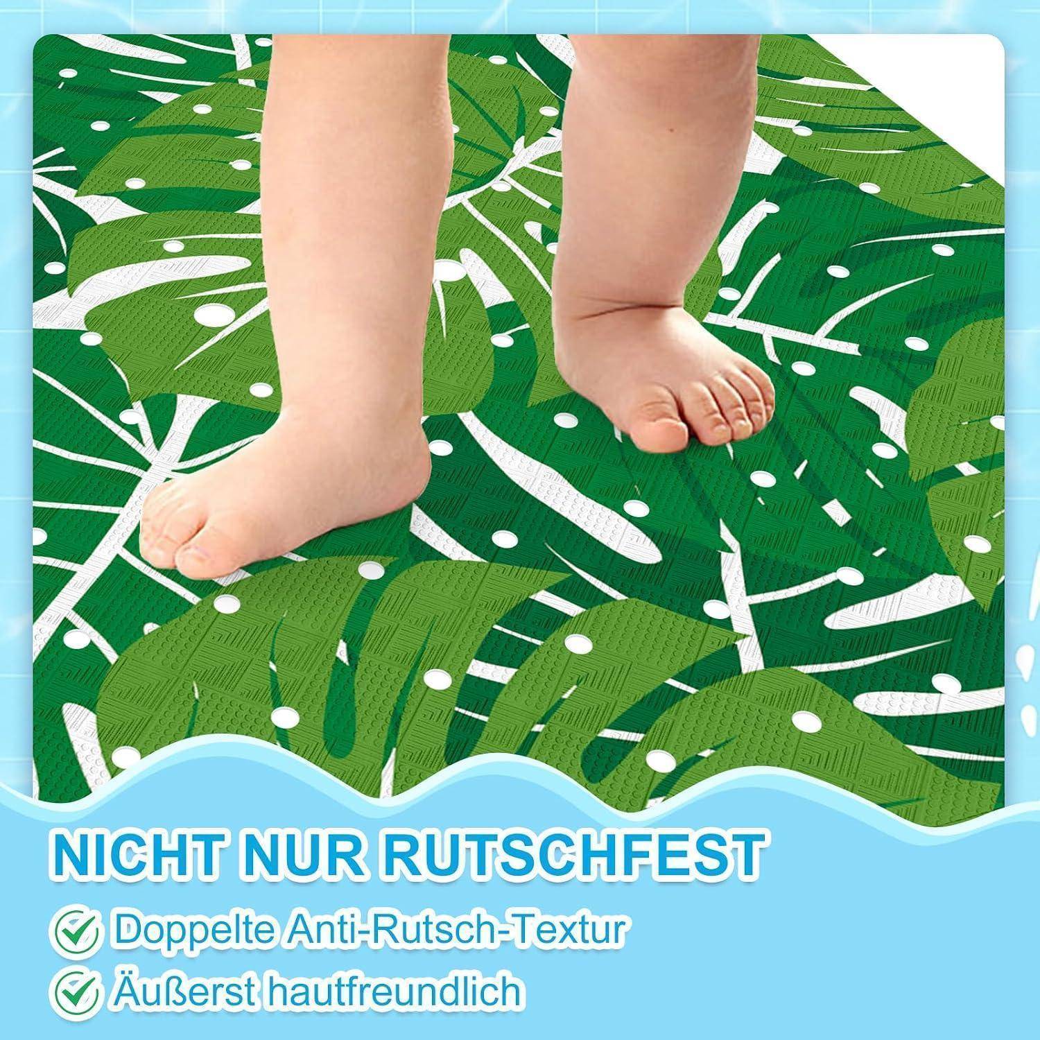 Babyfüße stehen auf einer grünen Matte mit Blattmuster und rutschfester Oberfläche, mit deutschem Text: 'NICHT NUR RUTSCHFEST', 'Doppelte Anti-Rutsch-Textur', 'Äußerst hautfreundlich'.