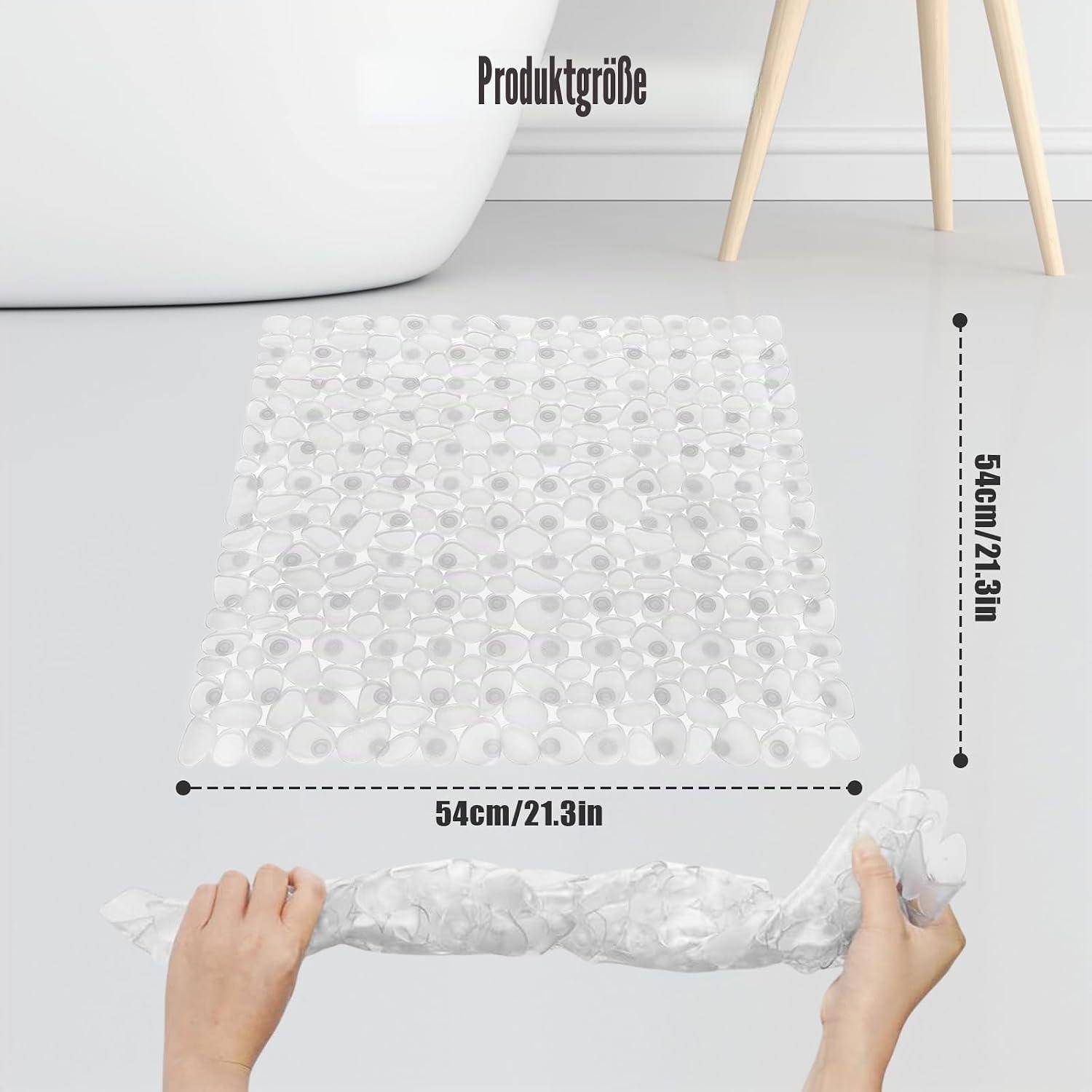 Transparente quadratische Blasenmatte in der Produktgröße 54 cm x 54 cm dargestellt, mit Händen, die sie auf einem hellen Boden aufrollen.