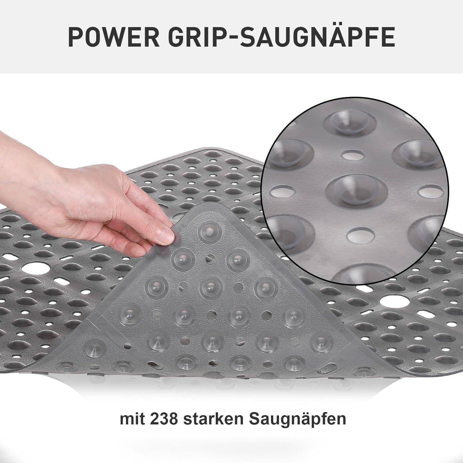 Hand hebt eine perforierte Anti-Rutsch-Matte mit Saugnäpfen; Text lautet „POWER GRIP-SAUGNÄPFE