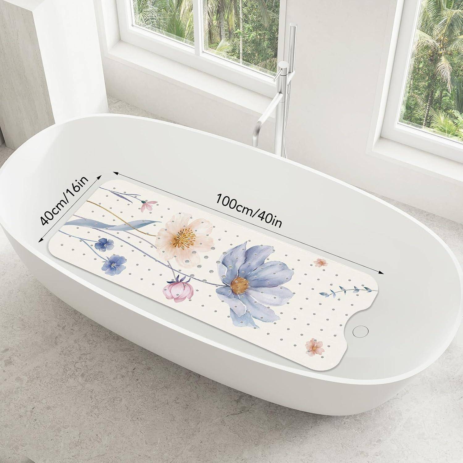 Weiße ovale Badewanne mit einer Blumenbadematte mit einer Länge von 100 cm/40 Zoll und einer Breite von 40 cm/16 Zoll.