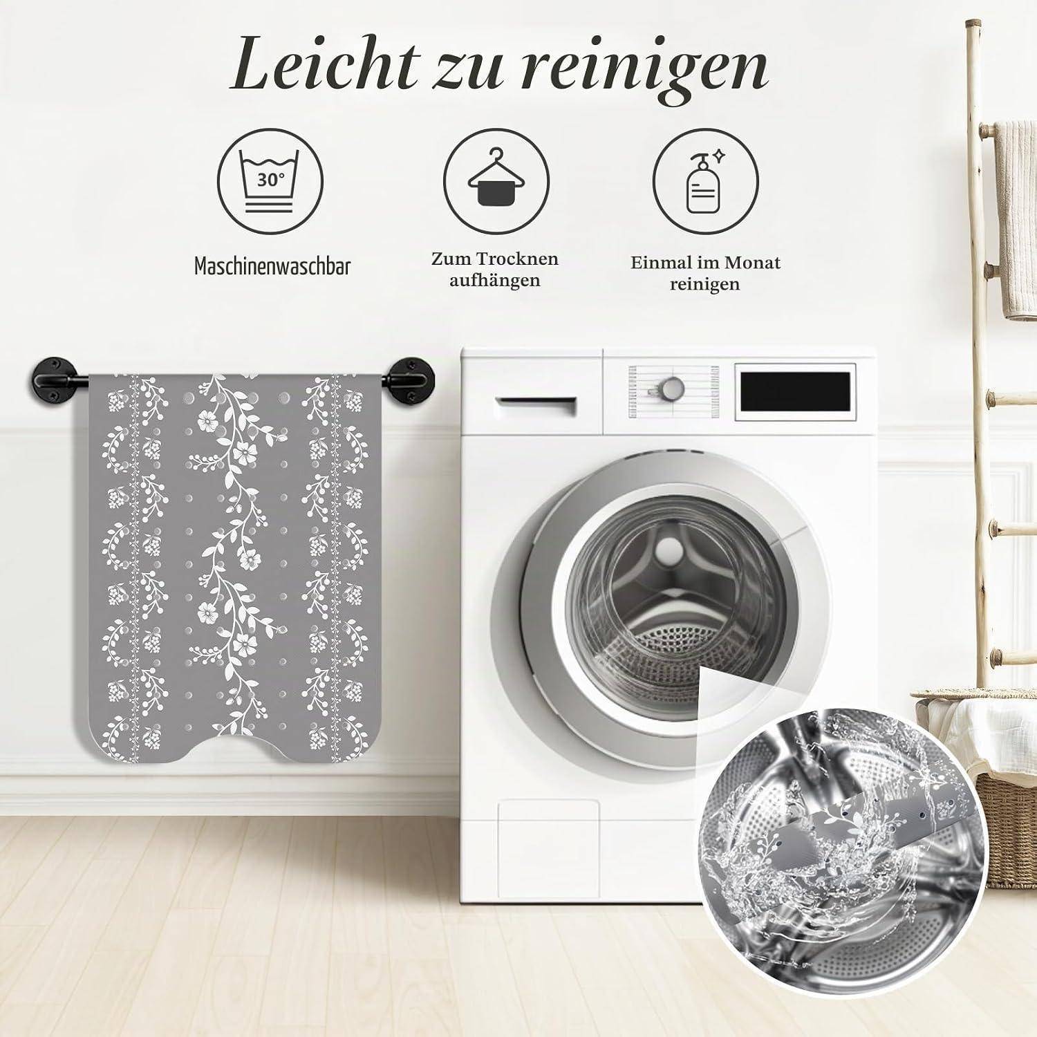 Werbebild zeigt eine graue Blumenmuster-Waschmaschinenbezug neben einer Frontladwaschmaschine, mit deutscher Beschriftung als leicht zu reinigen, maschinenwäschbar, zum Trocknen aufhängen und einmal monatlich reinigen.