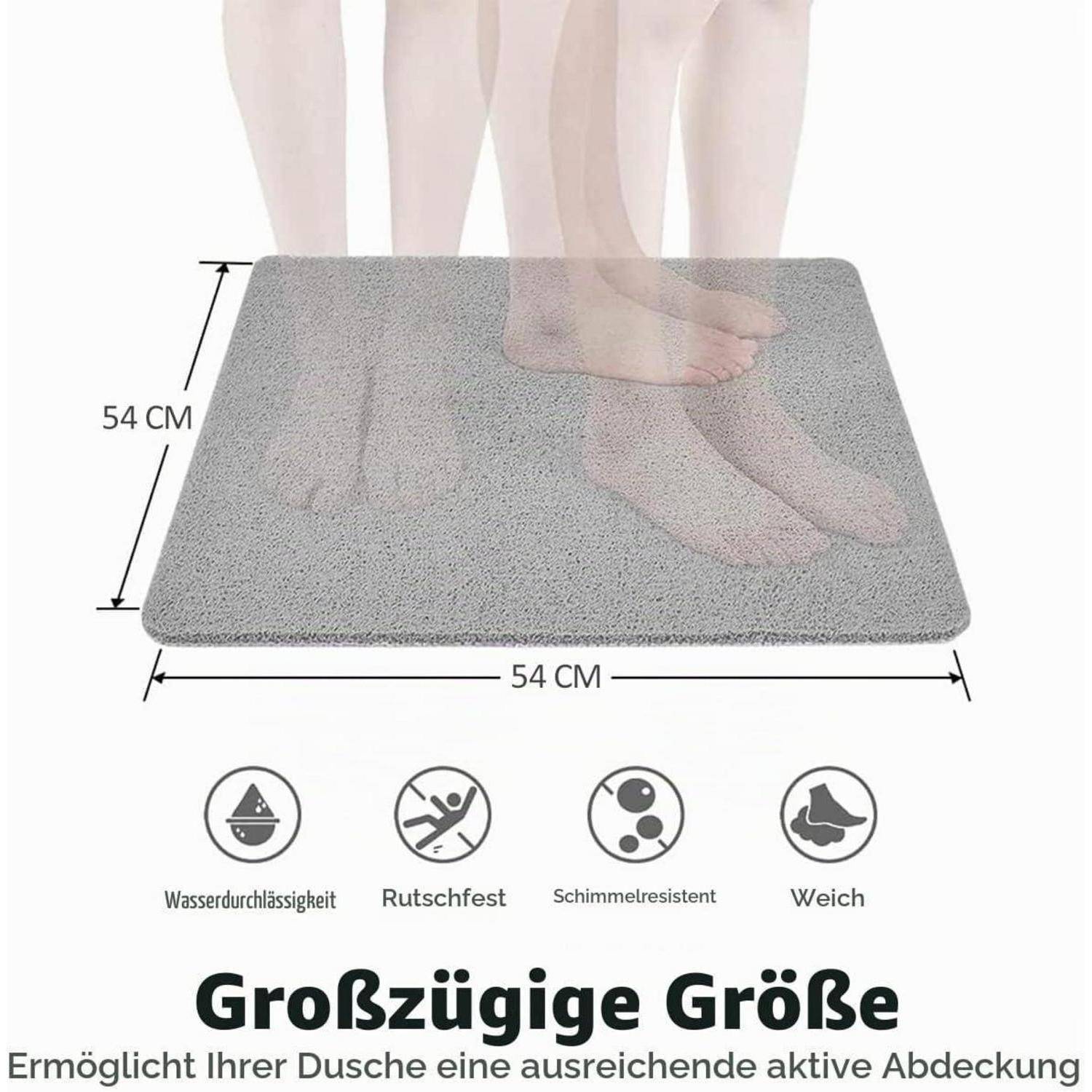 Quadratische graue Badmatte unter den Füßen gezeigt, 54 cm x 54 cm, mit Symbolen, die wasserdicht, rutschfest, schimmelresistent und weich angeben.
